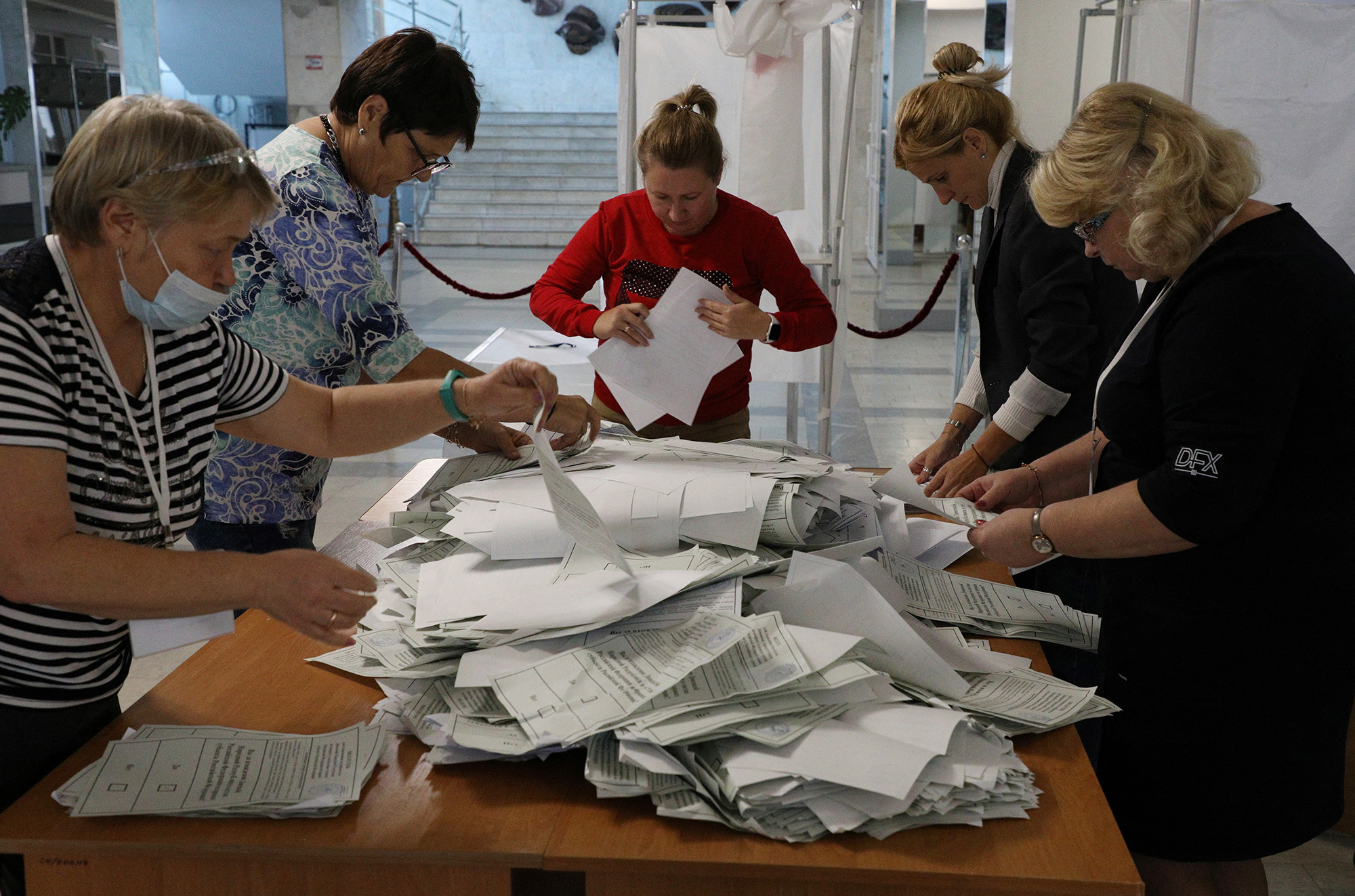 Members of a local electoral commission count ballots at a polling station following a referendum on the joining of Russian-controlled regions of Ukraine to Russia, in Sevastopol, Crimea, on September 27.
