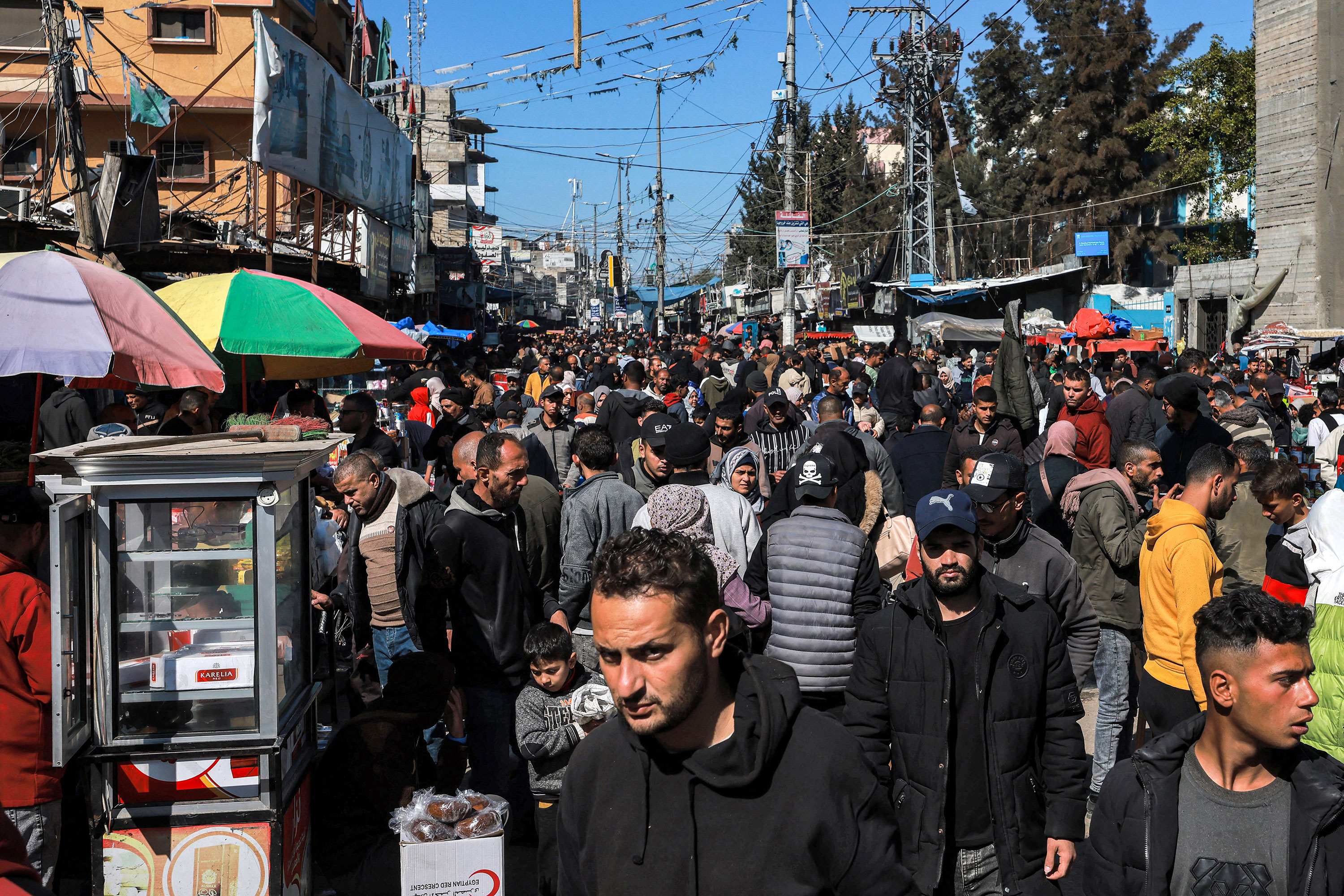 People walk along a crowded street in Rafah, Gaza, on February 8. 