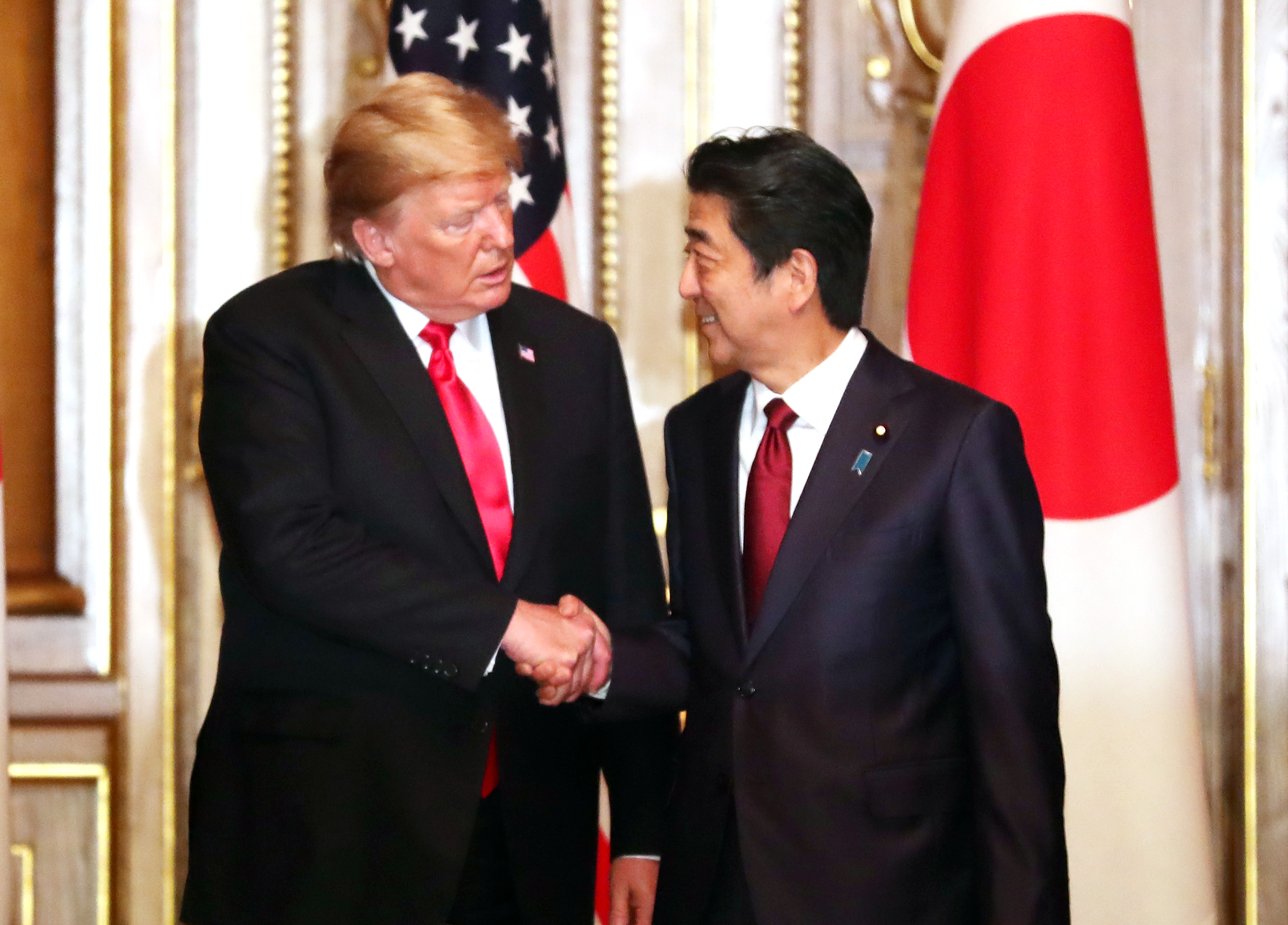 President Donald Trump shakes hands with Japanese Prime Minister Shinzo Abe prior to their working luncheon at the Akasaka guesthouse in Tokyo on May 27, 2019 in Tokyo, Japan. 