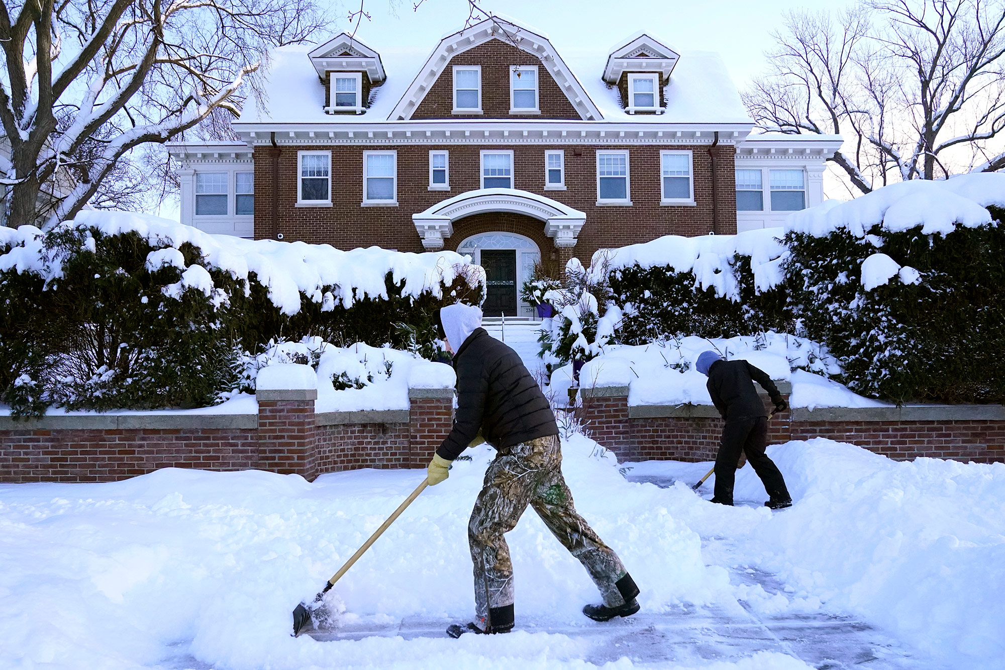 People shovel snowfall  connected  December 22, successful  Minneapolis, Minnesota. 