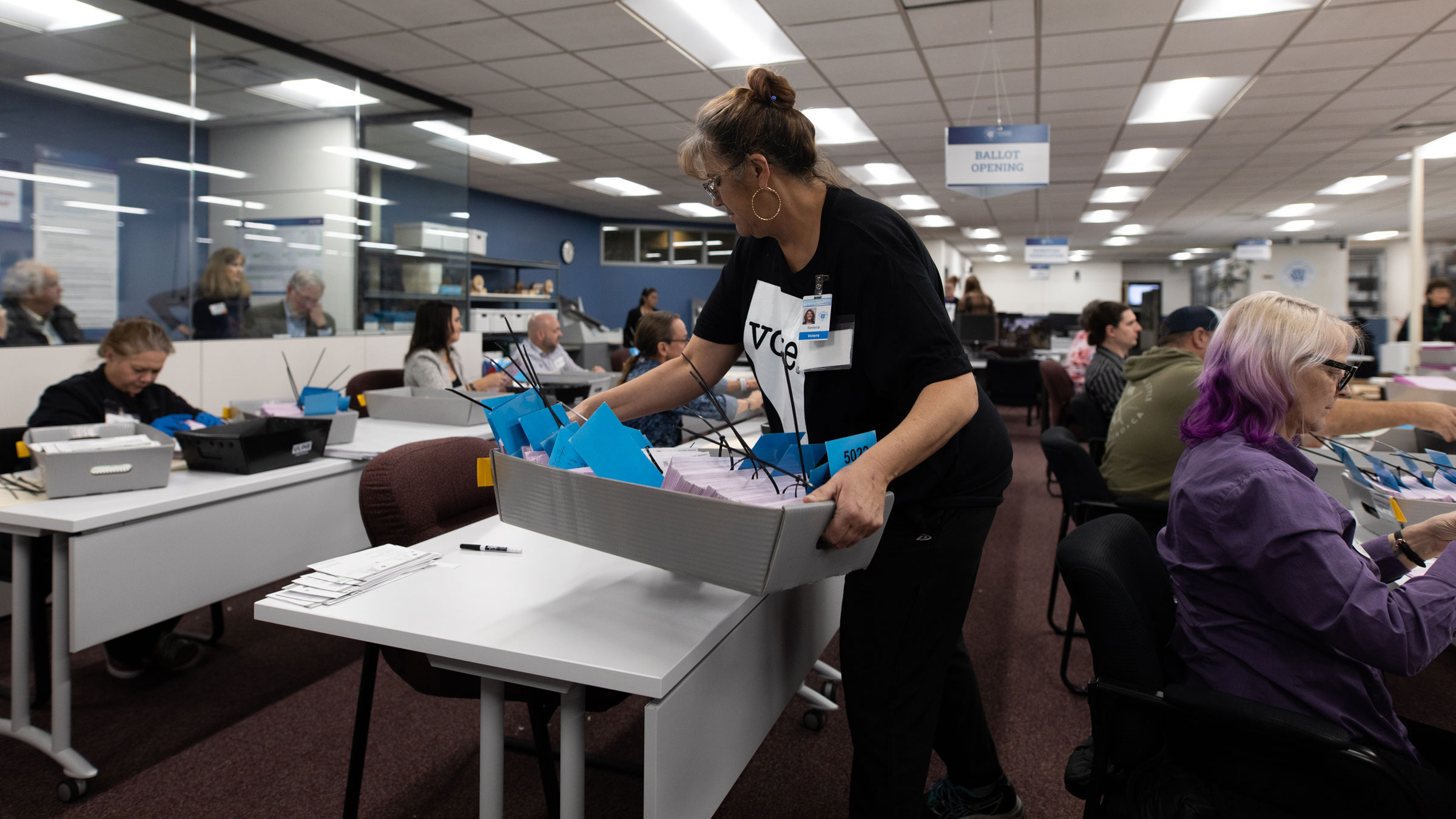 Election officials sort mail-in ballots Tuesday at the Washoe County Registrar of Voters Office in Reno, Nevada.