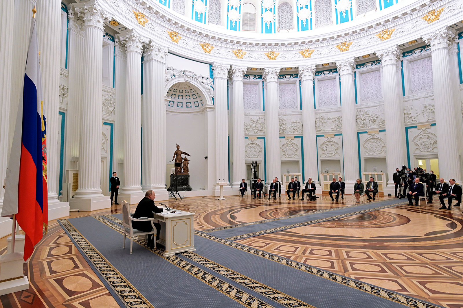 Russian President Vladimir Putin meets with members of his Security Council in Moscow on February 21.