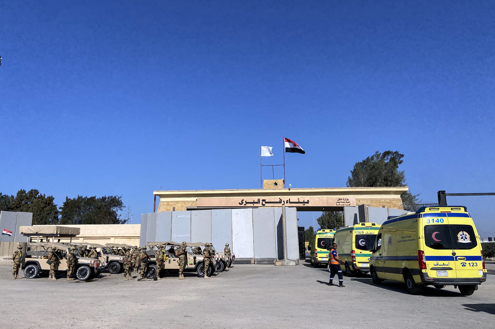 Ambulances queue to cross the Rafah border from the Egyptian side on November 6.