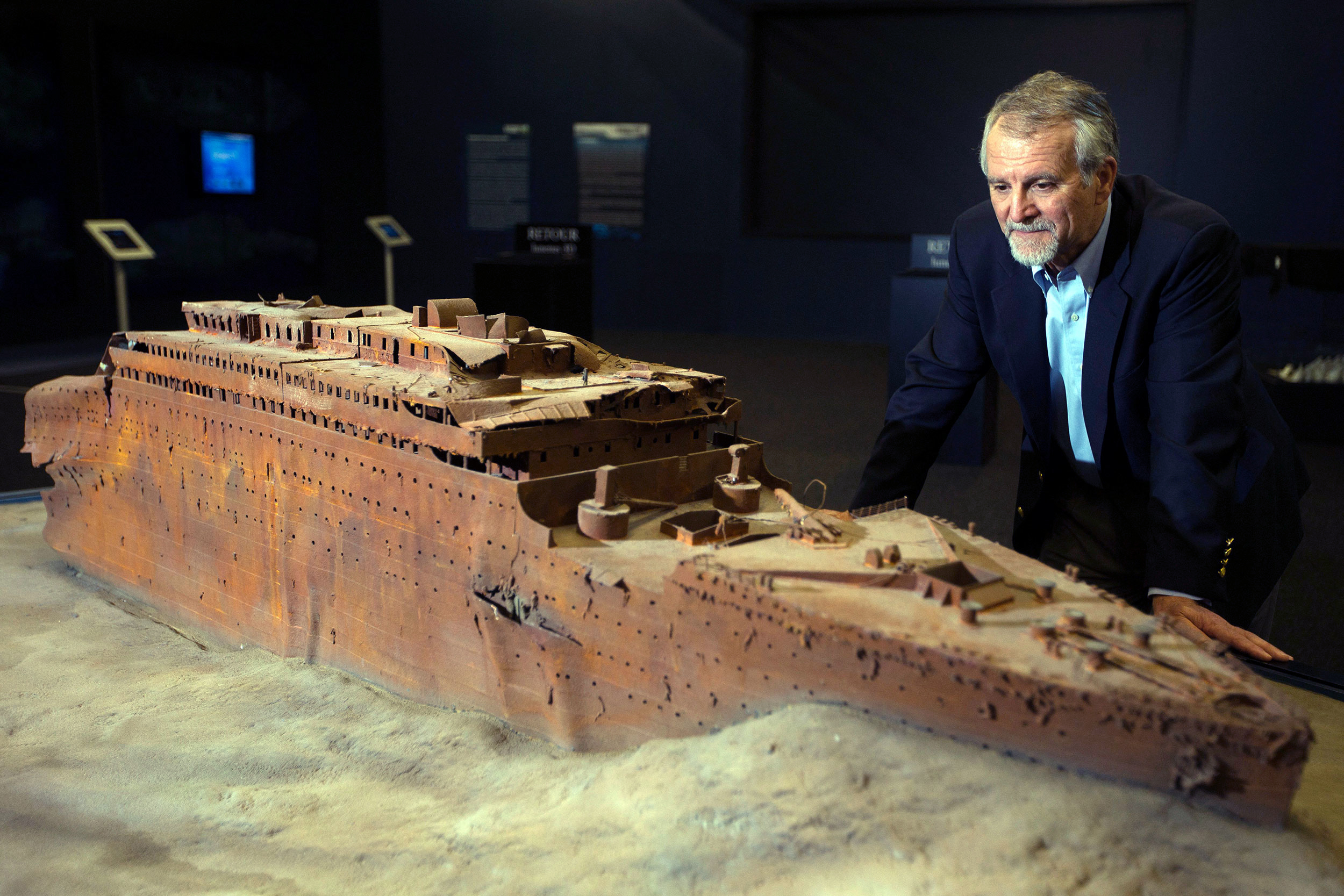 Paul-Henri Nargeolet poses next to a miniature version of the Titanic in Paris in 2013. 