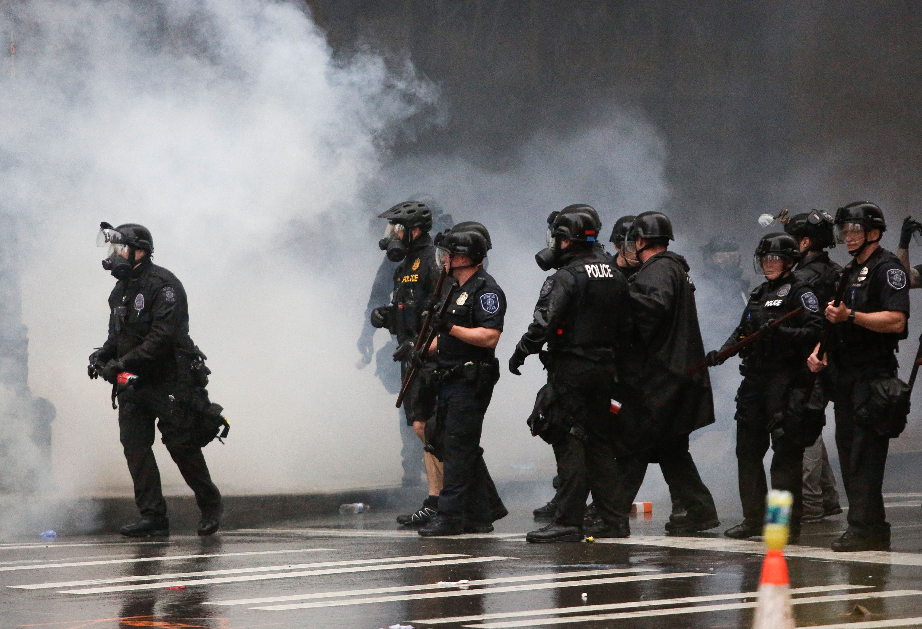 Police use tear gas during protests on May 30 in Seattle.