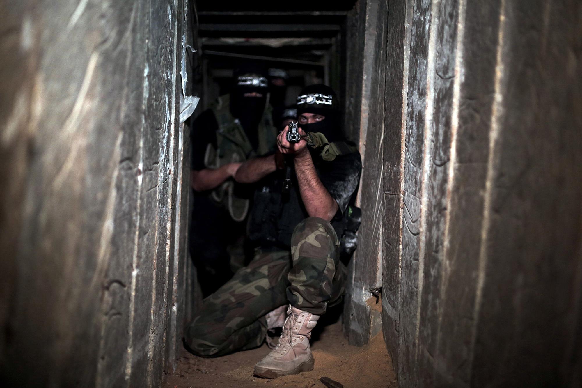 Armed Izz ad-Din al-Qassam Brigades, military wing of Hamas, deploy at a tunnel in Shujaya neighborhood of Gaza City, Gaza, on August 17, 2014. 
