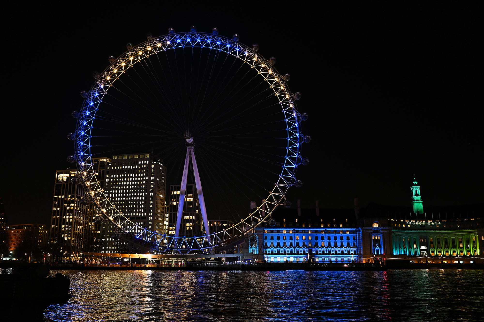 The London Eye joins landmarks around the world in lighting in unity with the people of the Ukraine, on February 25. 