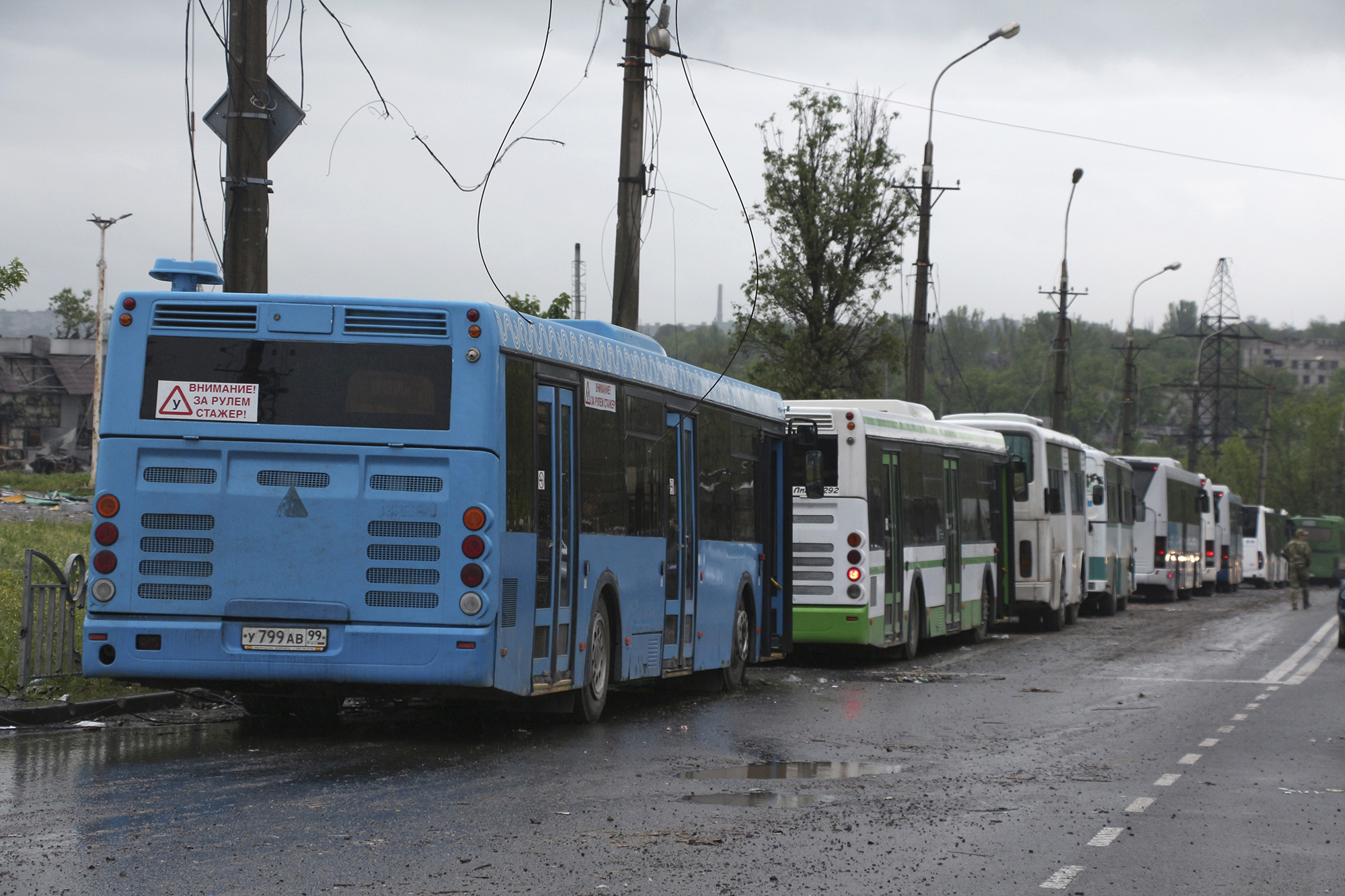 Buses wait for Ukrainian servicemen to transport them from Mariupol, Ukraine, to a prison in Olenivka after they left the besieged Azovstal steel plant, on May 18.