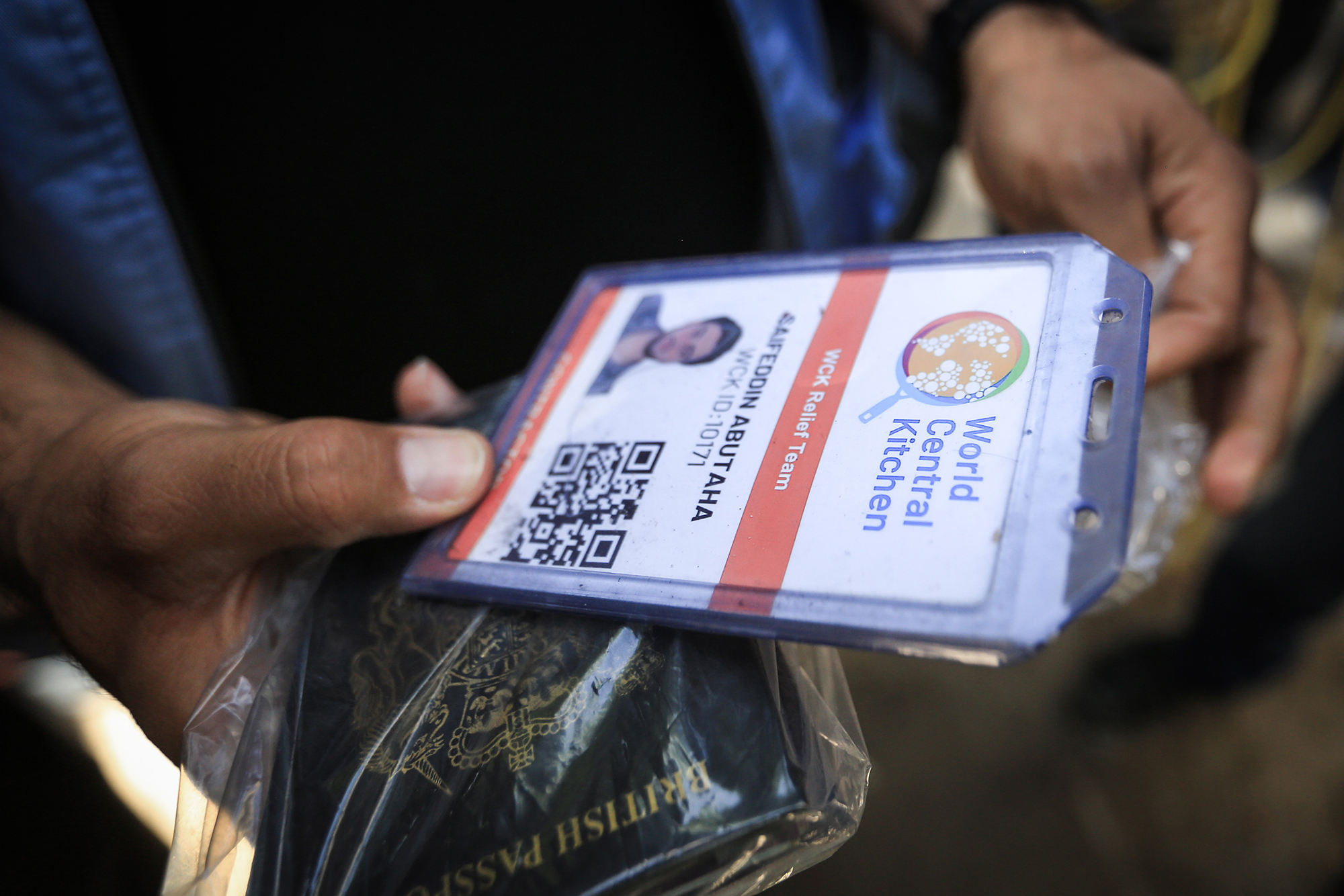 A person in Rafah, Gaza, on April 3 carries the credentials of a member of the World Central Kitchen aid group, who was killed in an Israeli airstrike.