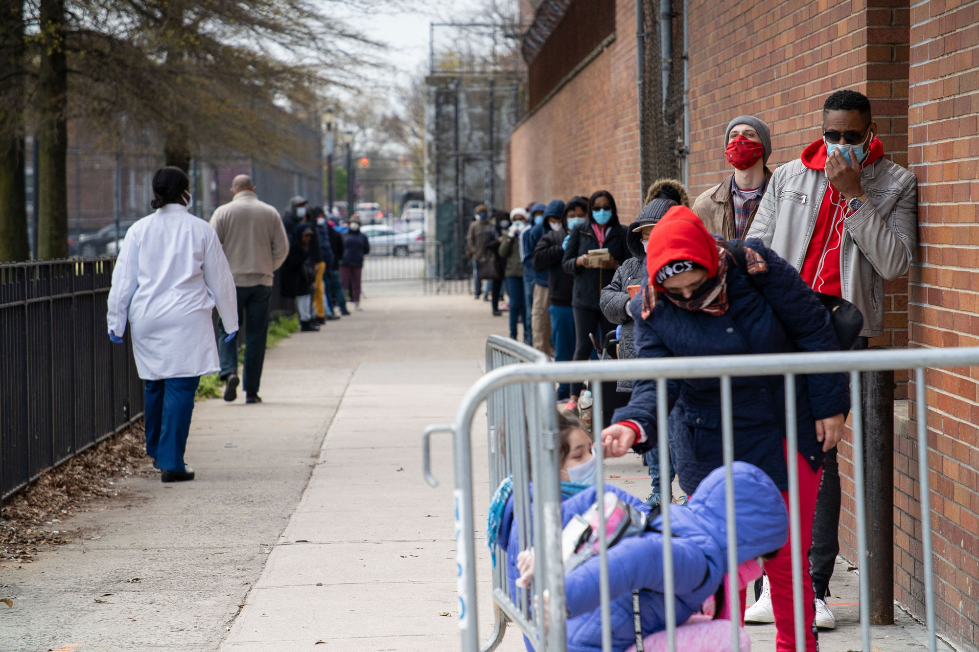 People line up at a new testing tent outside Gotham Health in Brooklyn, New York.