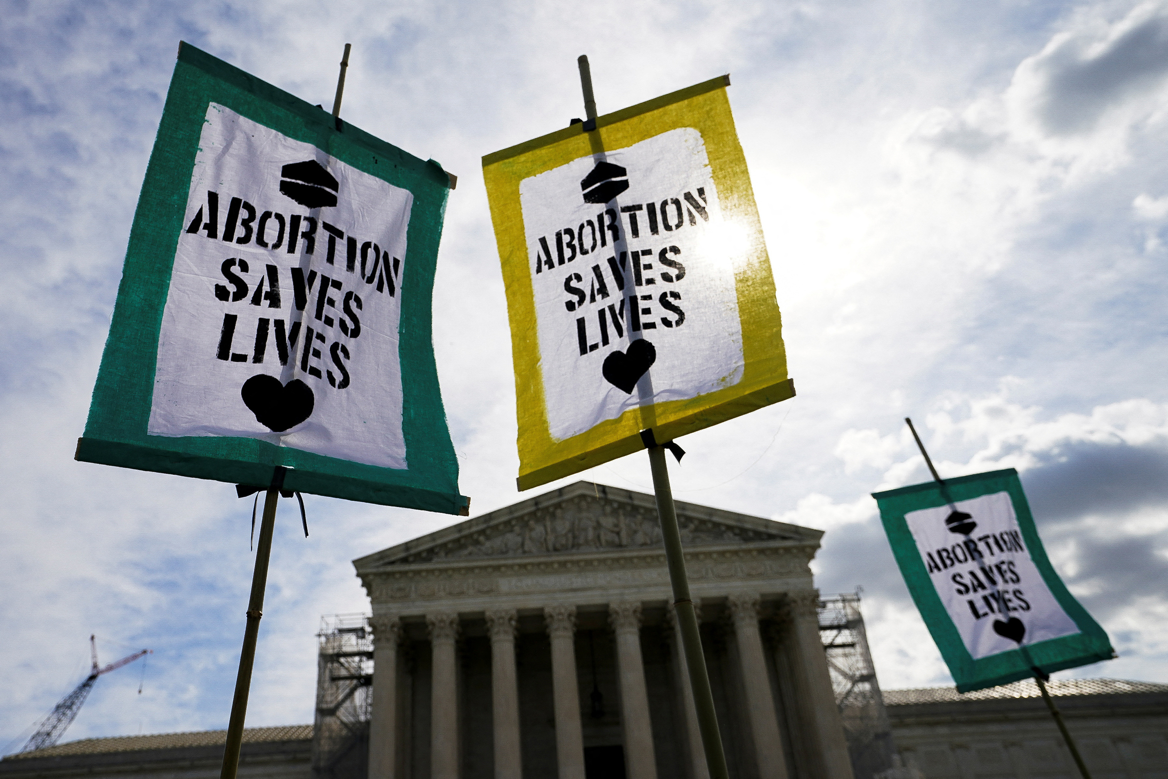 Protesters raise placards in support of abortion rights at the US Supreme Court.