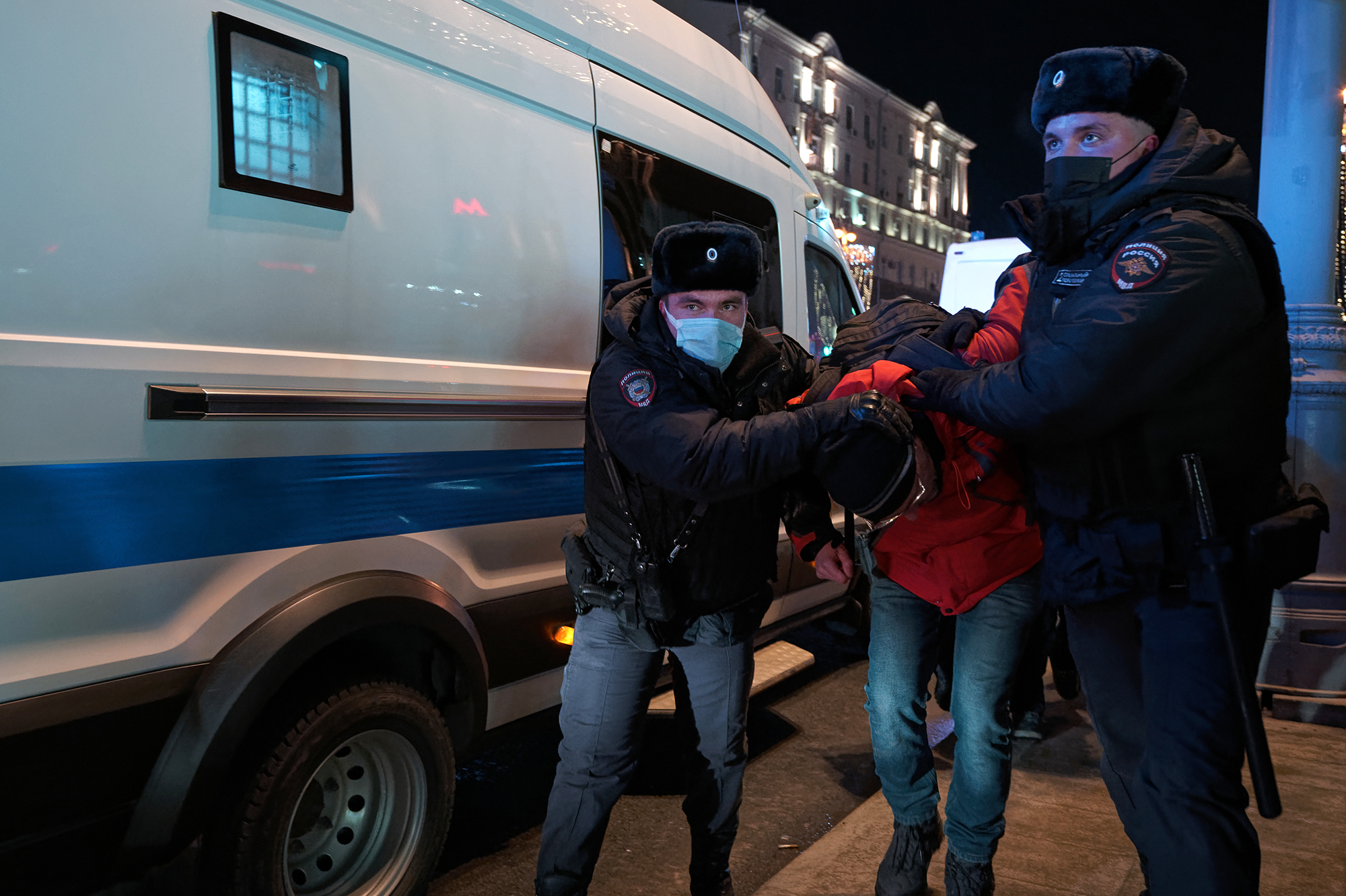 A demonstrator against the invasion of Ukraine is led away by police in Moscow, on February 24.