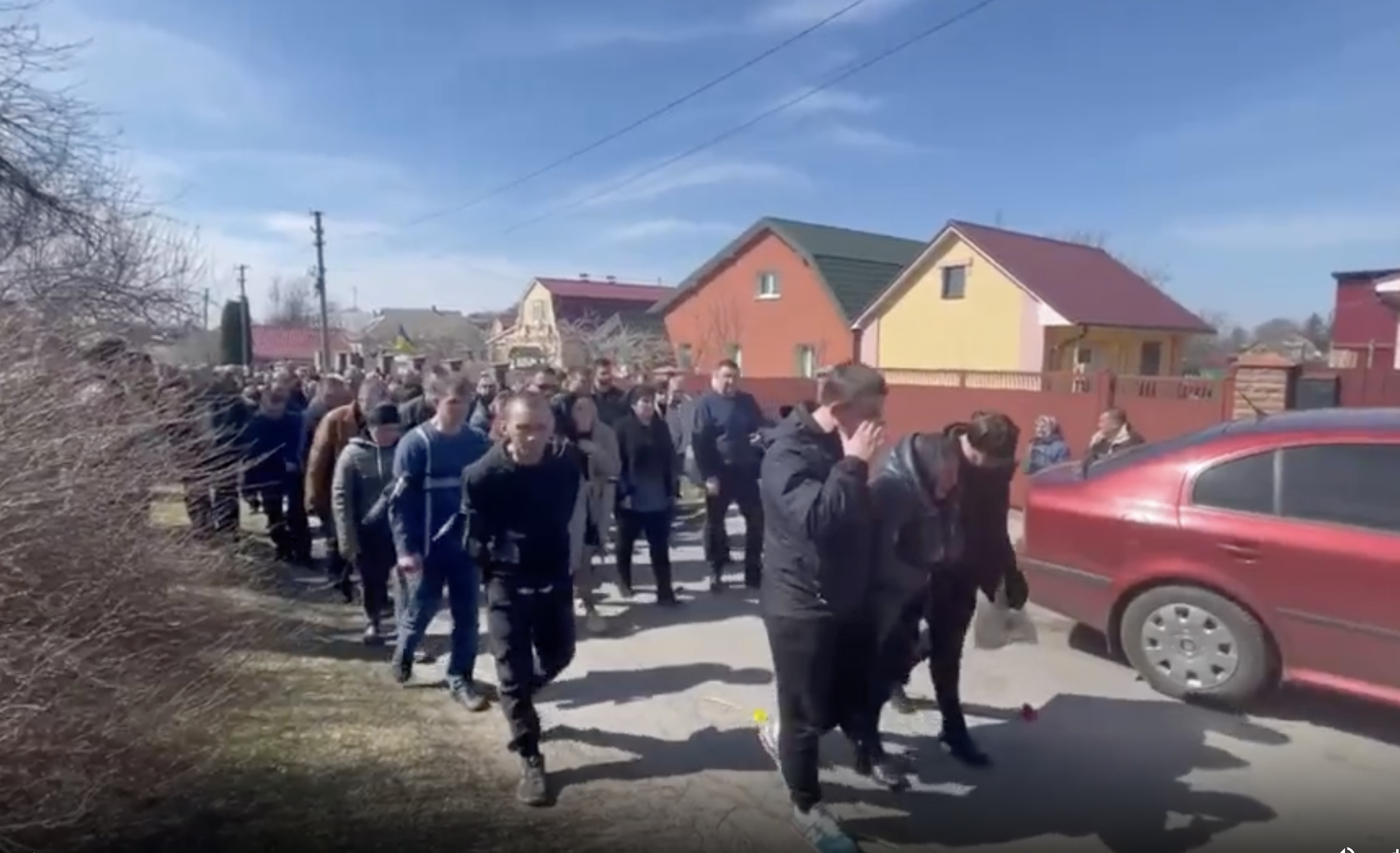 A funeral procession for Olha Sukhenko, a Ukrainian village mayor who was found murdered after Russian forces left the Kyiv region, on April 8.