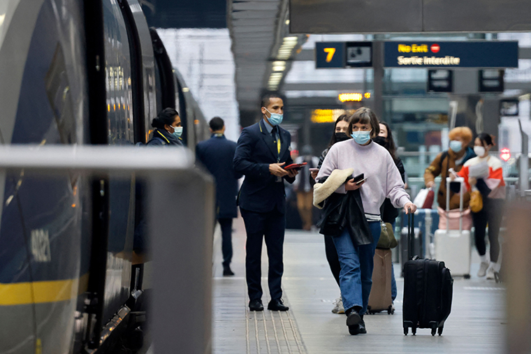 Passengers board a Eurostar train at St Pancras International station in London on December 17, 2021.
