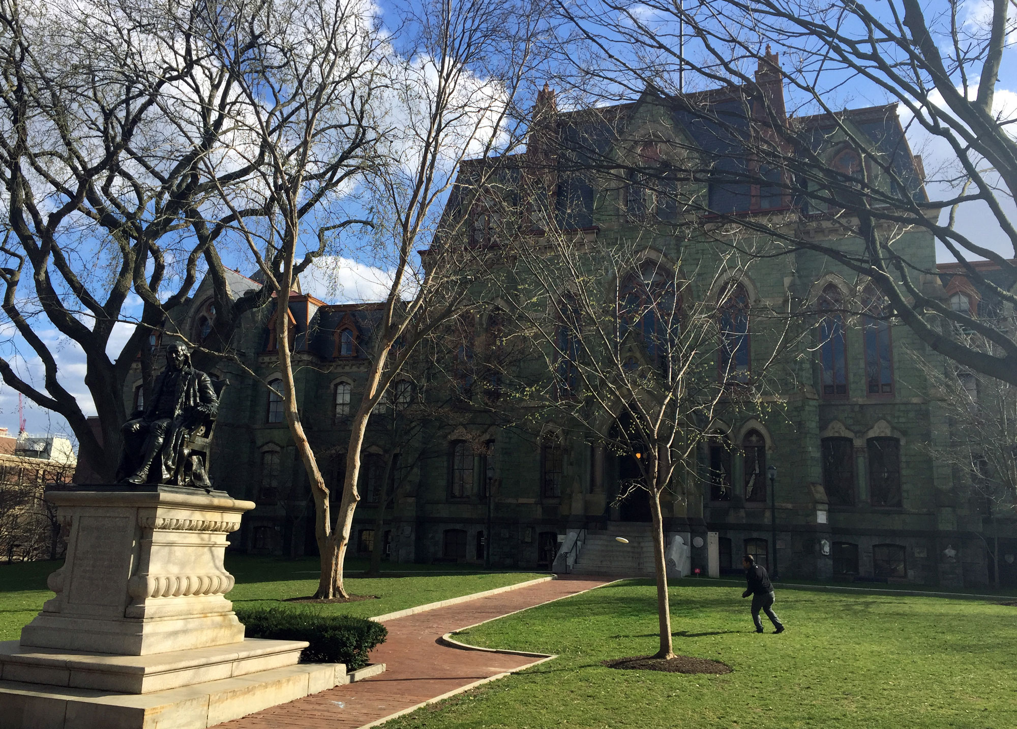 A person walks near College Hall on the University of Pennsylvania campus in Philadelphia on March 20, 2016.