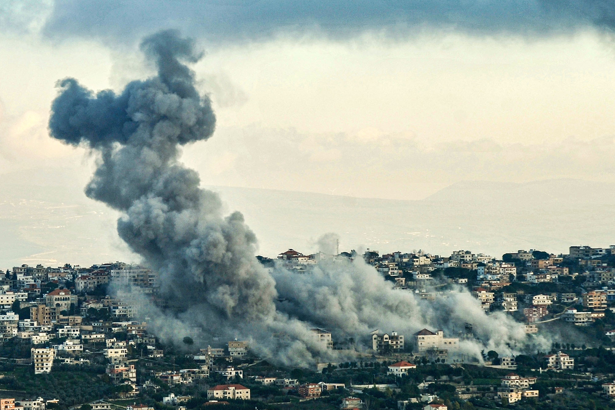 Smoke billows over the southern Lebanese border village of El-Khiam during Israeli bombardment on February 7.