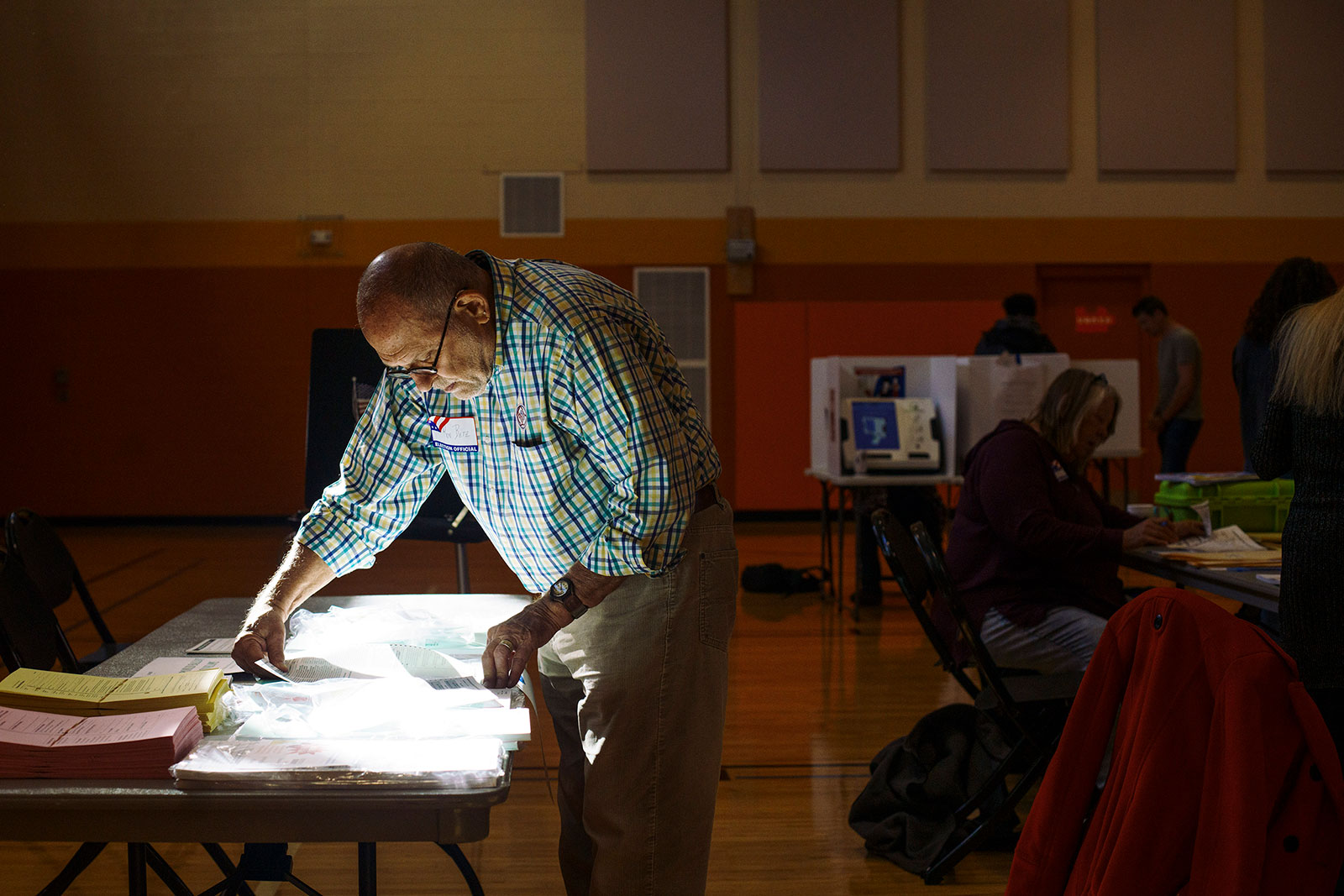 Ron Betz, a poll worker, pulls a provisional ballot for a voter at a polling location on November 8, in Columbus, Ohio. 
