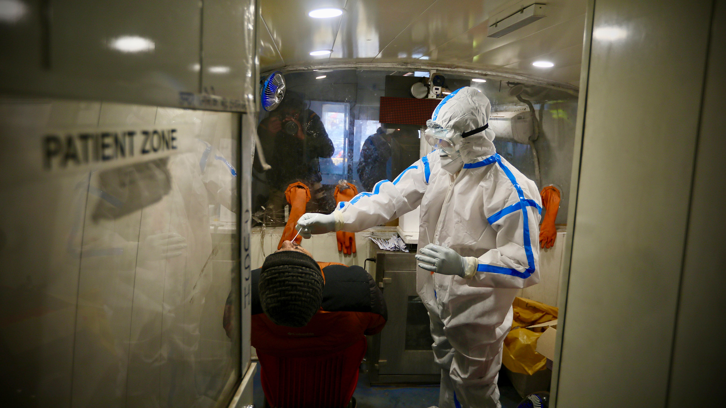 A health worker takes a nasal swab sample to test for Covid-19 on Saturday, December 19 in New Delhi, India.