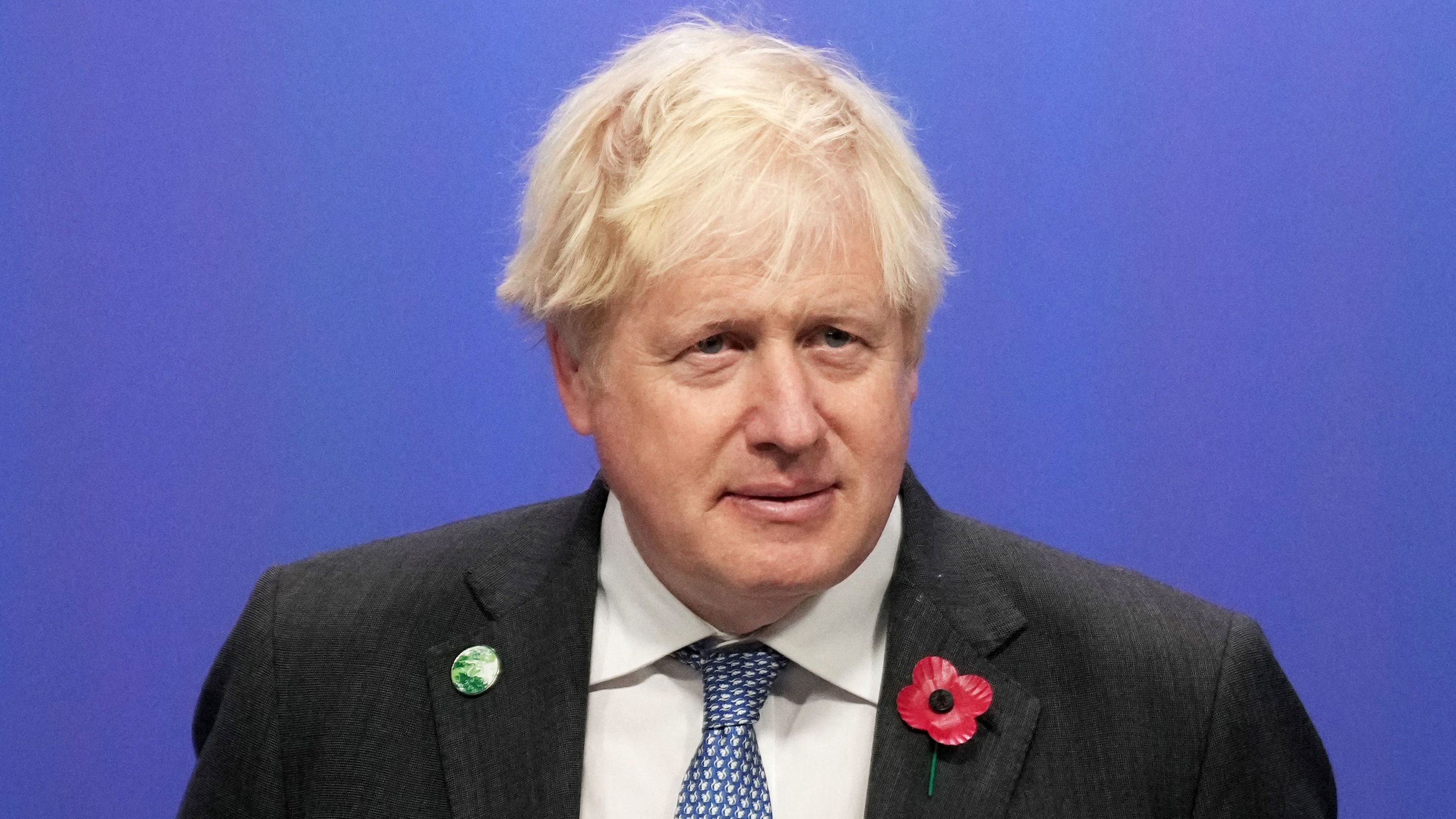Britain's Prime Minister Boris Johnson waits to greet leaders as they arrive to attend COP26 in Glasgow, Scotland, on November 1.