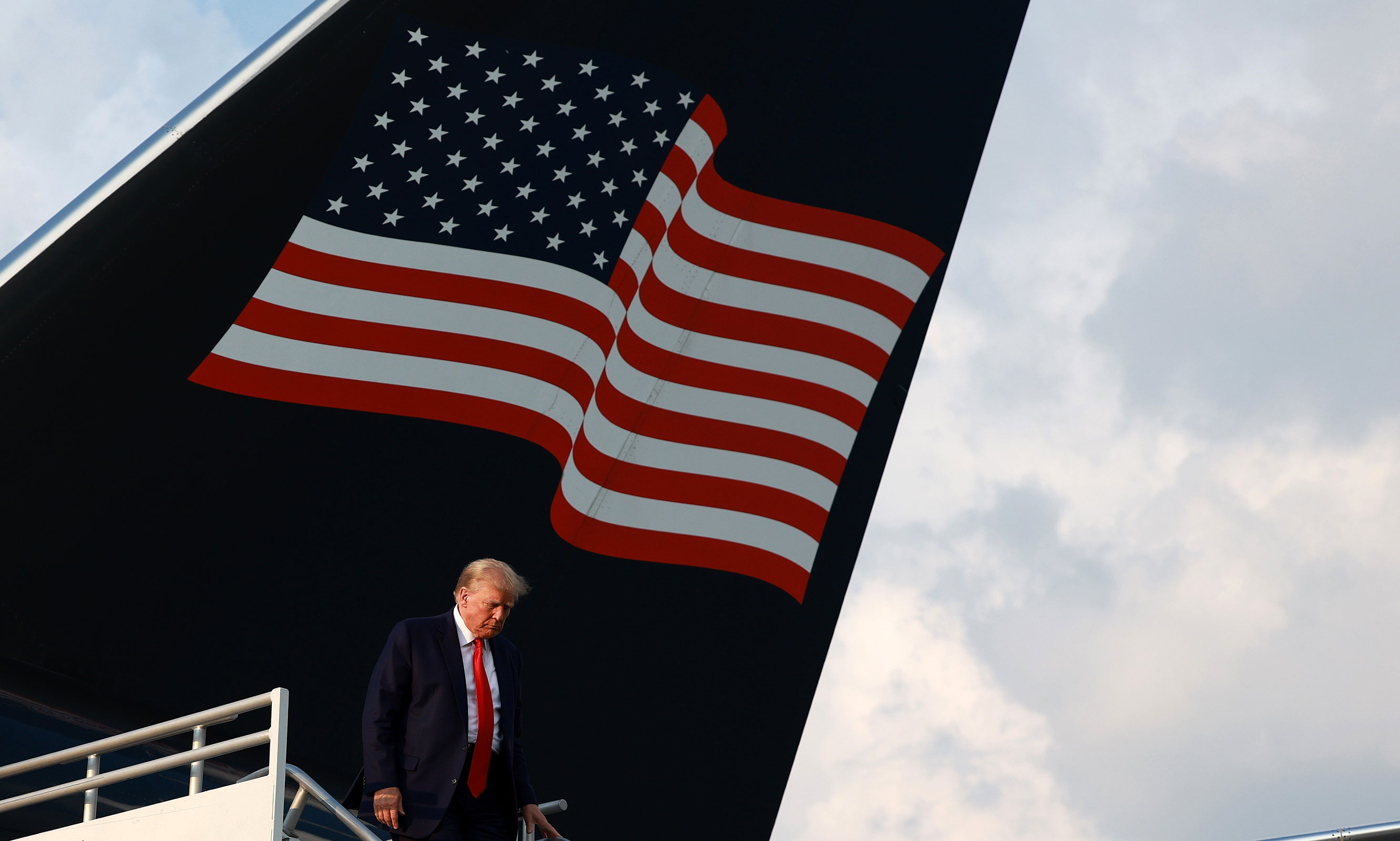 Former President Donald Trump arrives at Atlanta Hartsfield-Jackson International Airport on August 24, in Atlanta, Georgia.