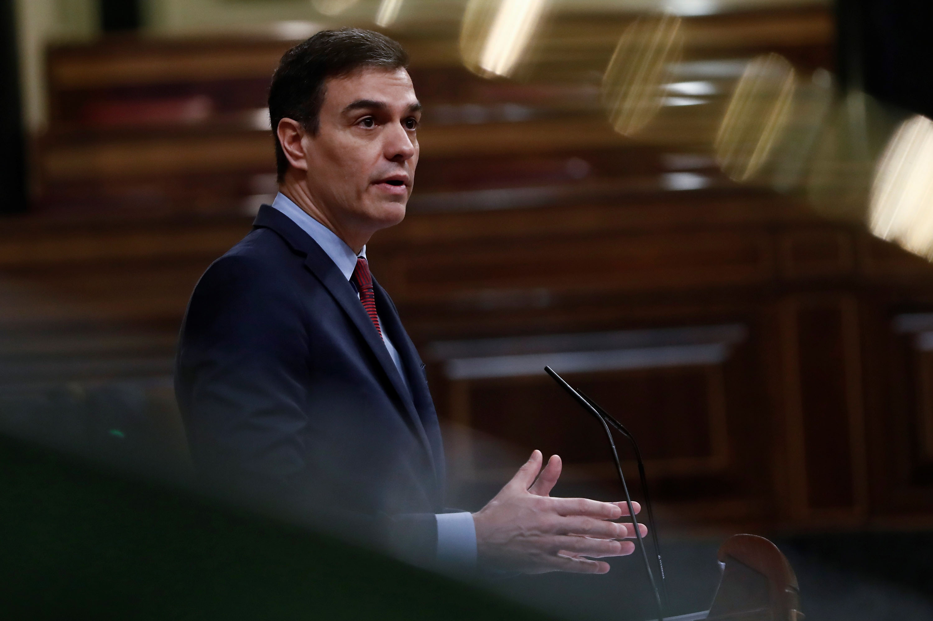 Spanish Prime Minister Pedro Sanchez delivers a speech at the Spanish Parliament in Madrid on April 9.