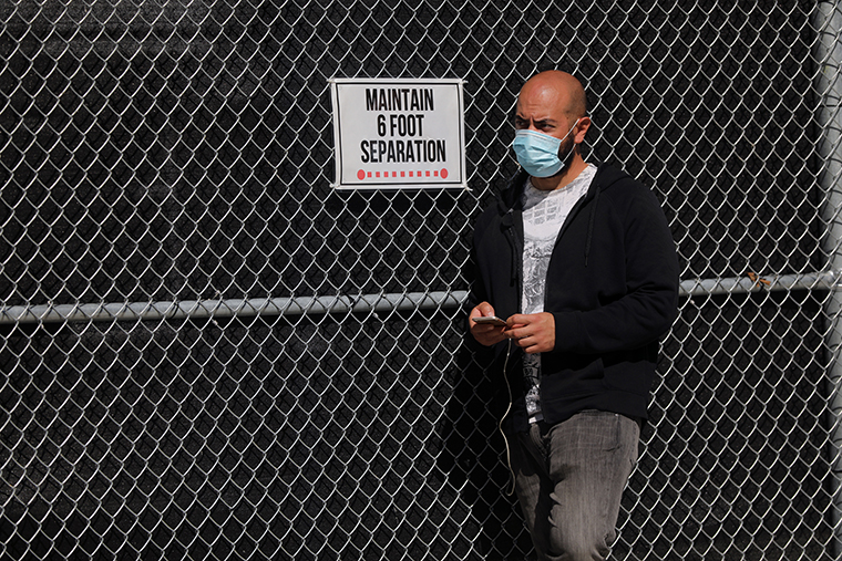 A person waits in line to be tested for COVID-19 at a city test site in the Brooklyn neighborhood of Borough Park on October 05, 2020 in New York City.