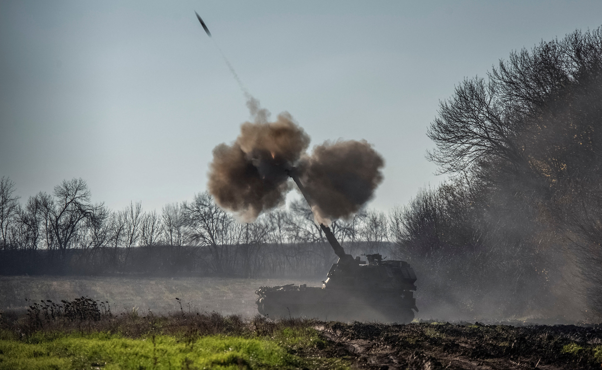 Ukrainian forces fire a howitzer round toward Russian positions in the Donetsk Oblast on Tuesday. 