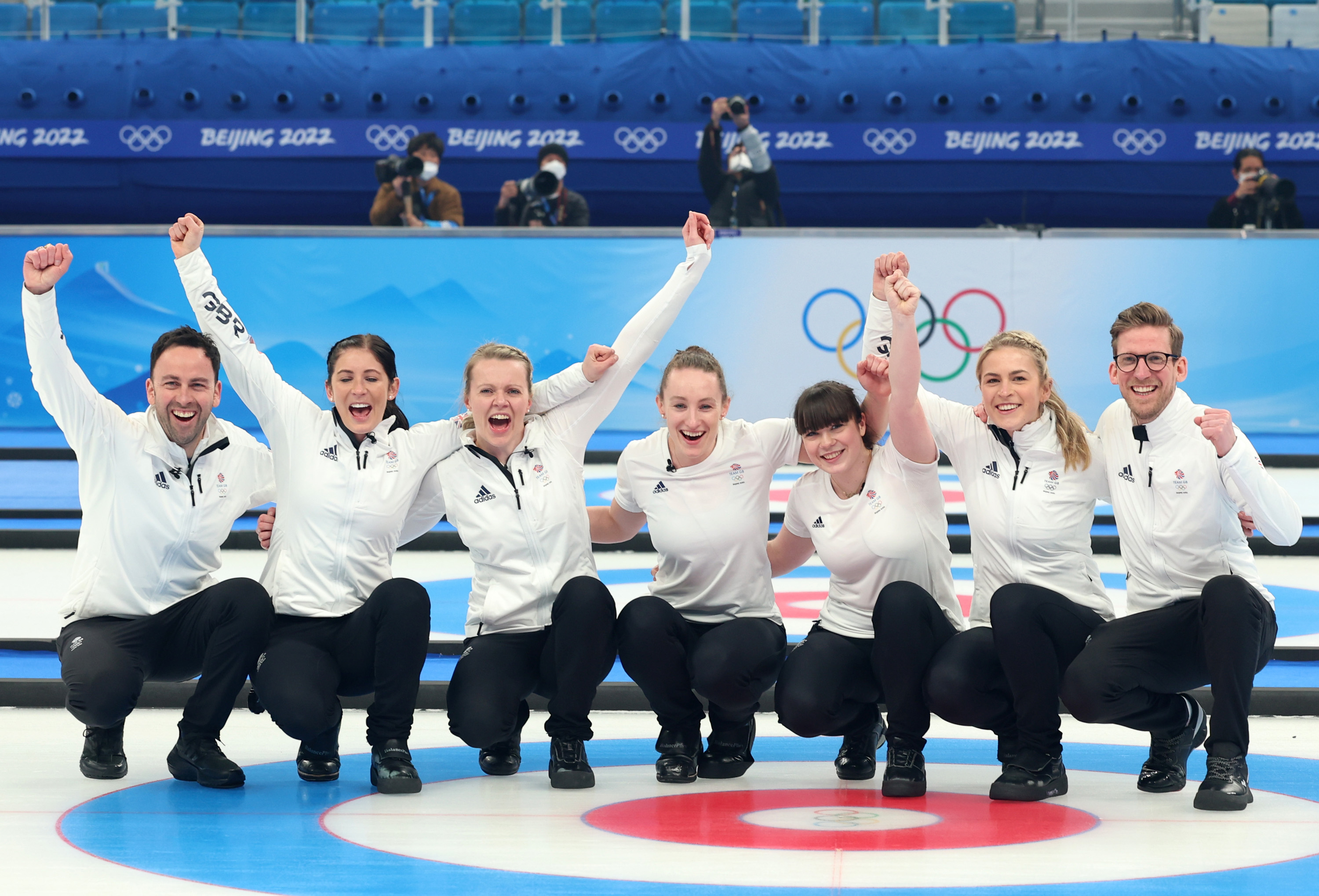 Team Great Britain celebrates after defeating Team Japan in the women's curling final on Sunday. 