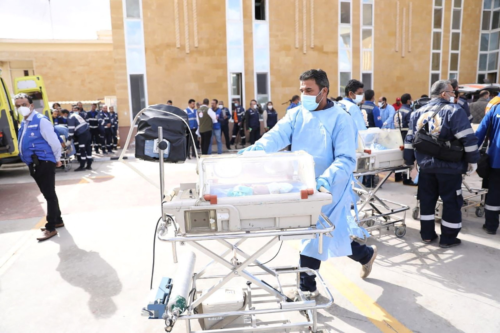 Medics transfer premature babies evacuated from Gaza to ambulances on the Egyptian side of the Rafah border on Monday, November 20. 