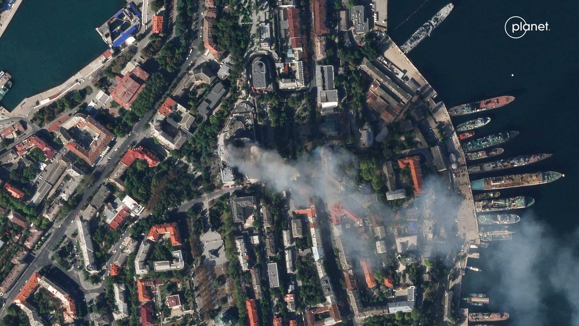A satellite image shows smoke billowing from a Russian Black Sea Navy headquarters after a missile strike in Sevastopol, Crimea, on September 22.
