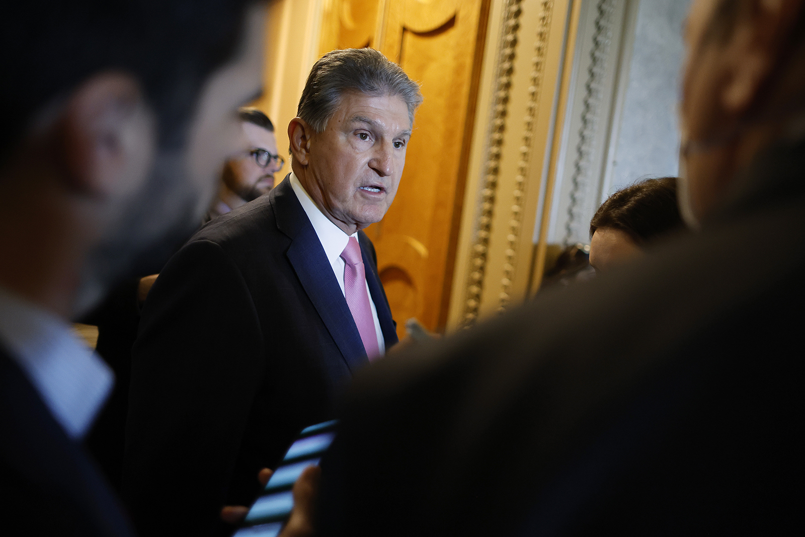 Sen. Joe Manchin (D-WV) talks to reporters before heading into the Senate Chamber for a vote at the U.S. Capitol on May 10 in Washington, DC.