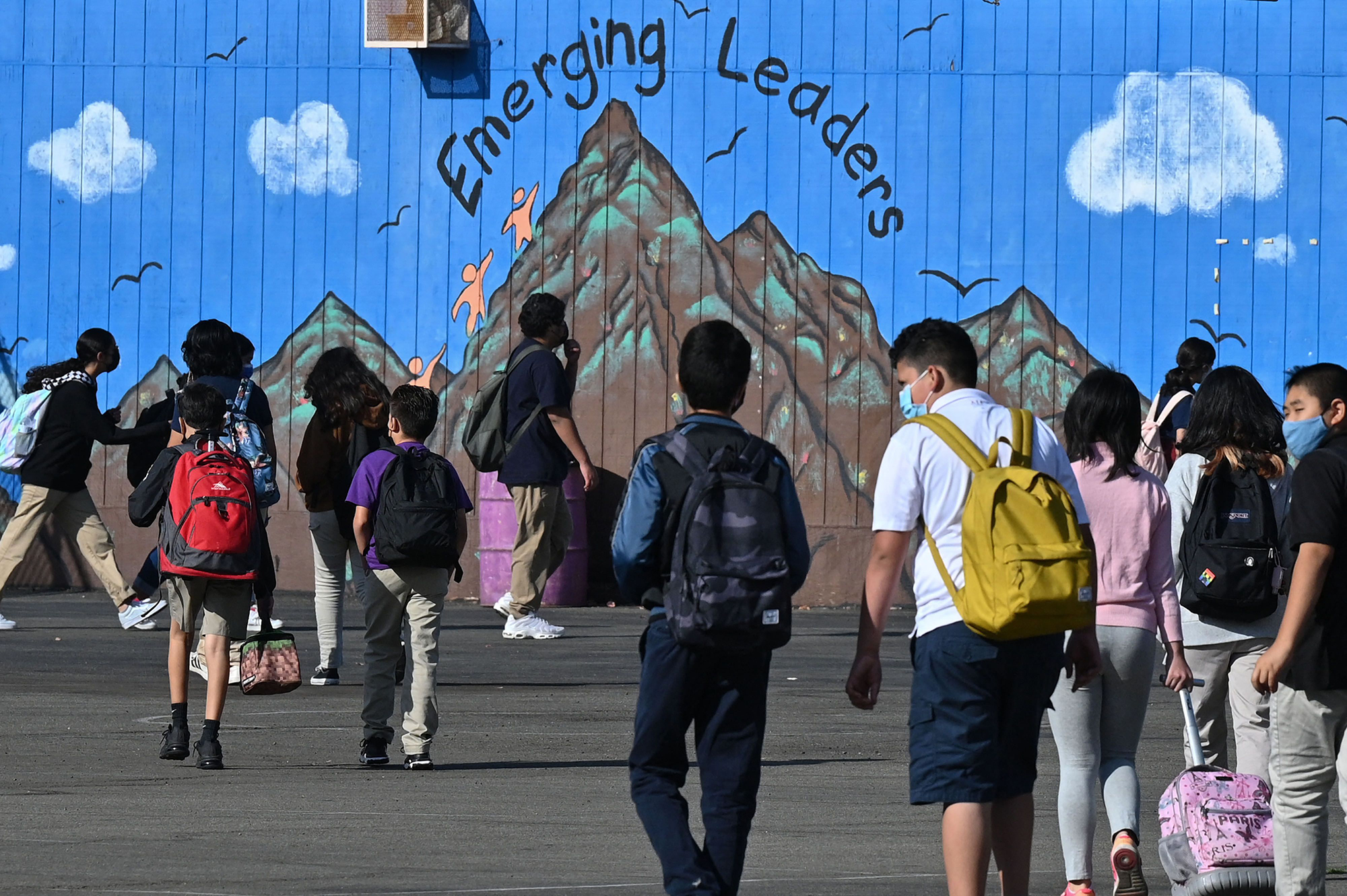 Students walk to their classrooms at a public middle school in Los Angeles, California, in September 2021. 