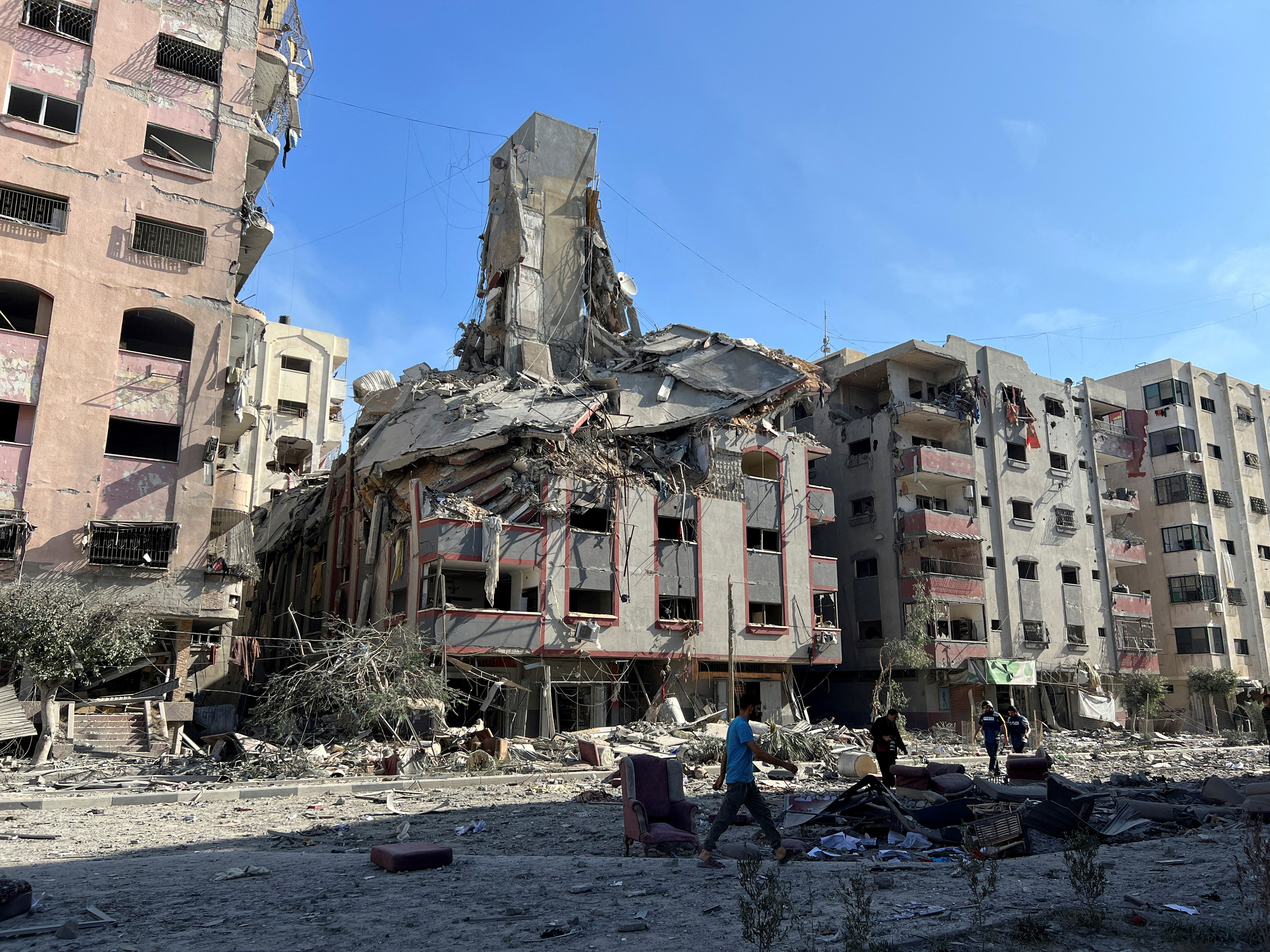 Damaged residential buildings are seen near Al-Quds hospital in Gaza City, on October 30.