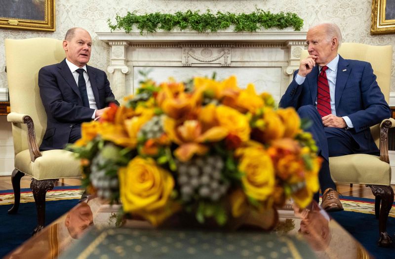 German Chancellor Olaf Scholz speaks alongside US President Joe Biden meets in the Oval Office of the White House on Friday.