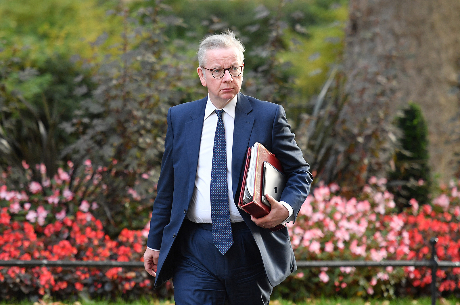 UK Minister for the Cabinet Office Michael Gove walks through Downing Street to attend the weekly meeting of the cabinet in London, on September 22.
