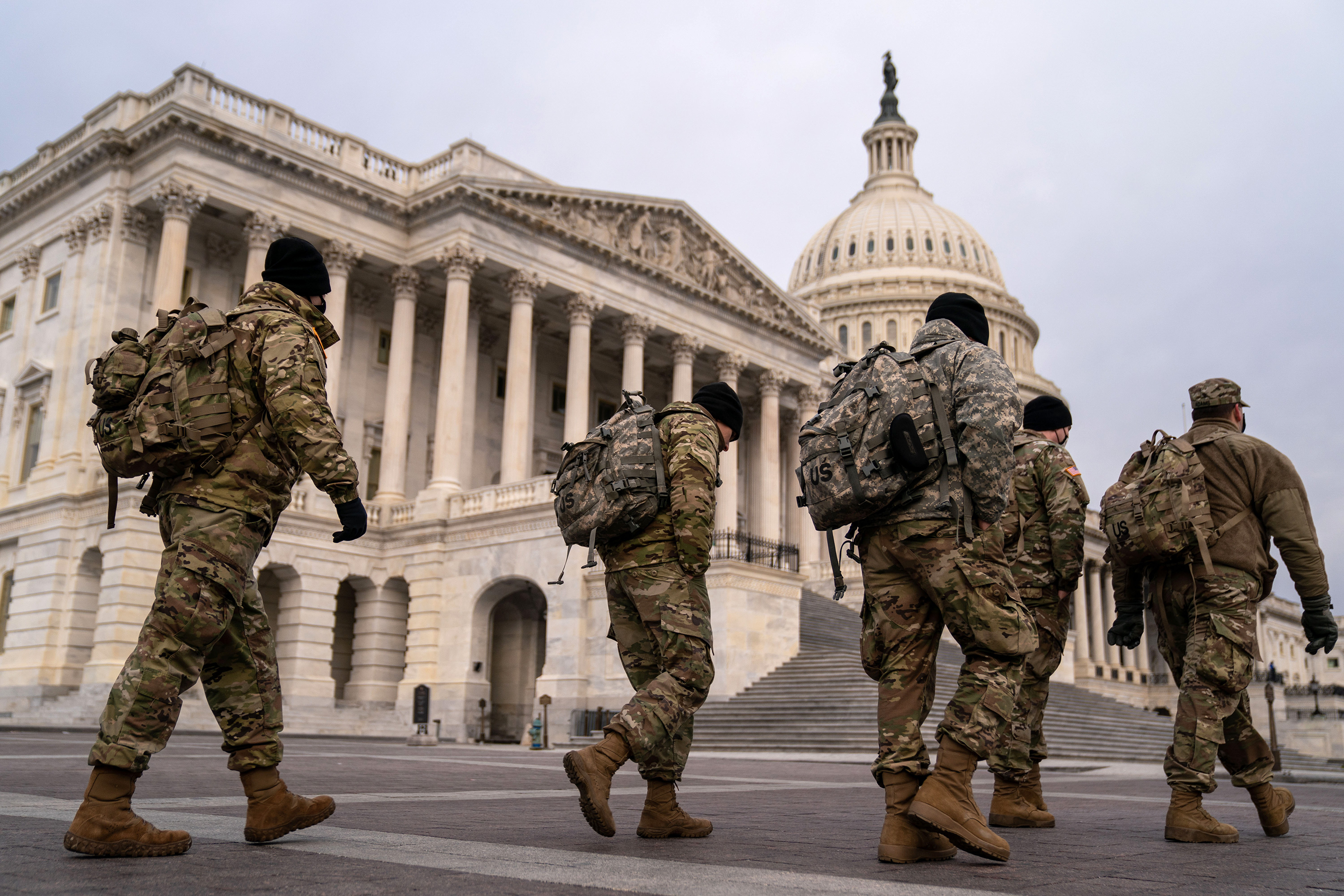 National Guard members are seen outside the US Capitol building on Monday, January 11 in Washington, DC.
