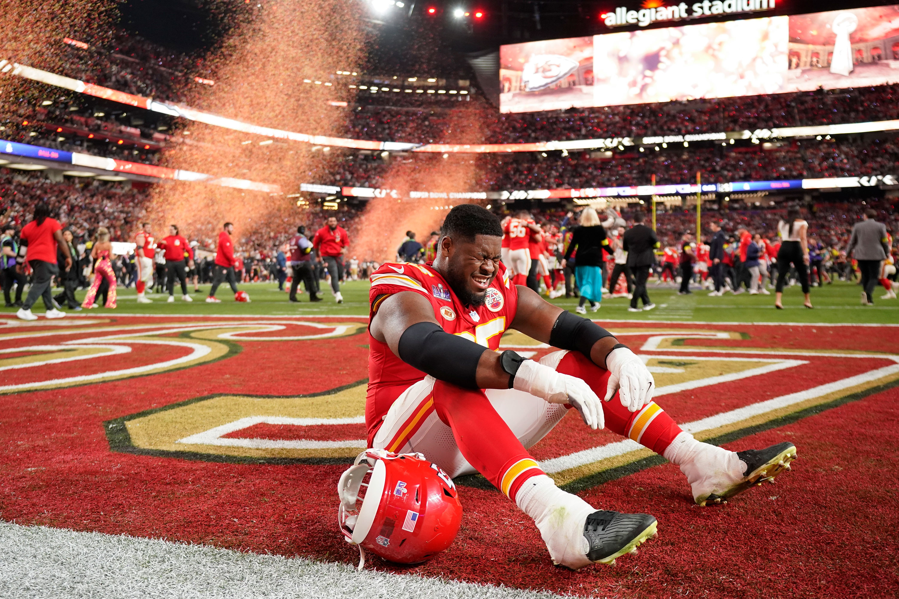 Kansas City Chiefs guard Trey Smith cries in the end zone after winning the Super Bowl.