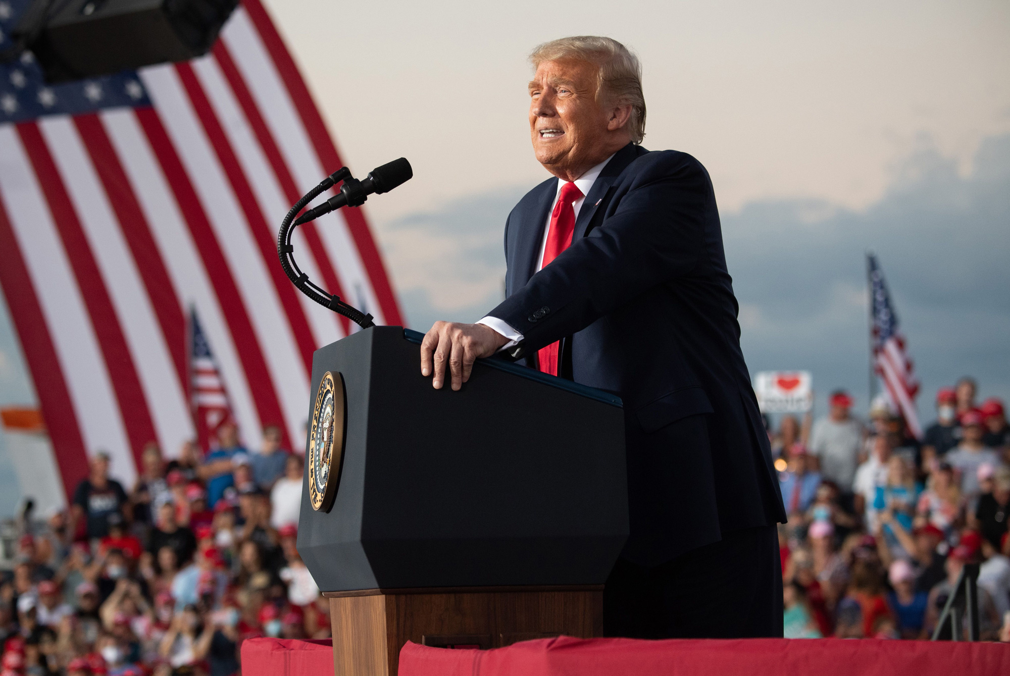 President Donald Trump speaks at a rally as he campaigns at Orlando Sanford International Airport in Sanford, Florida, on October 12.