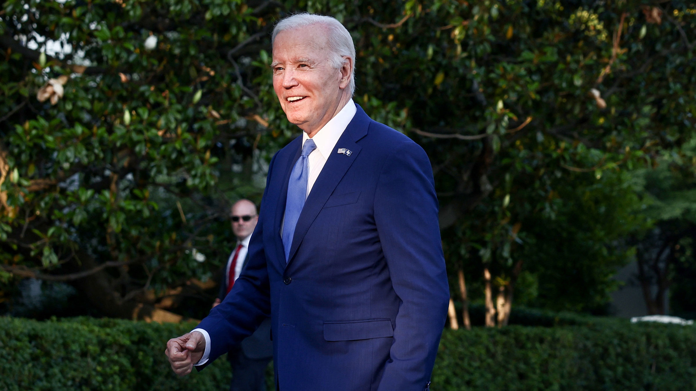 President Joe Biden talks to the media upon returning to the White House on Thursday.