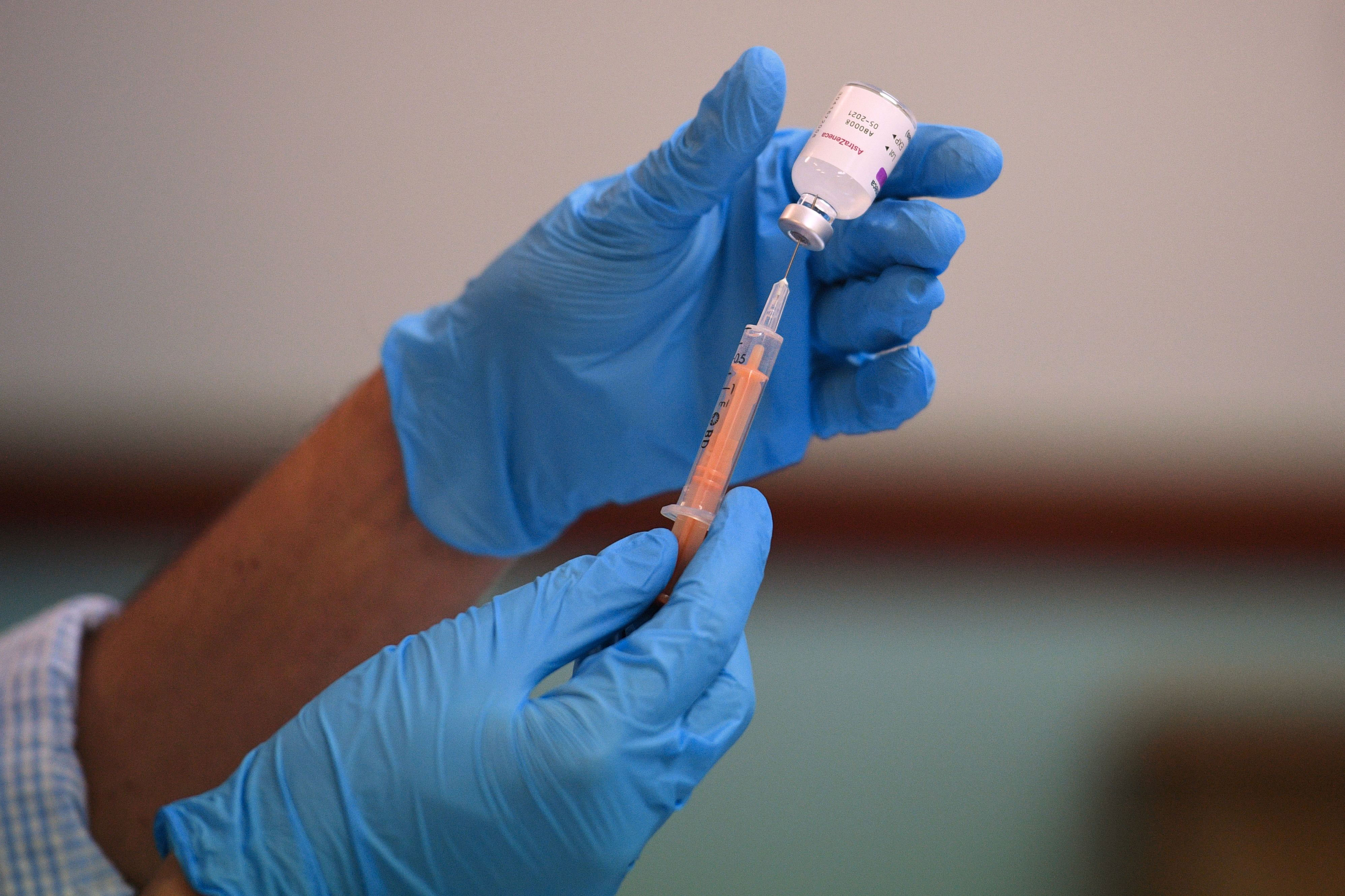 A pharmacist prepares a dose of the Oxford/AstraZeneca Covid-19 vaccine in Birmingham, England, on February 4.