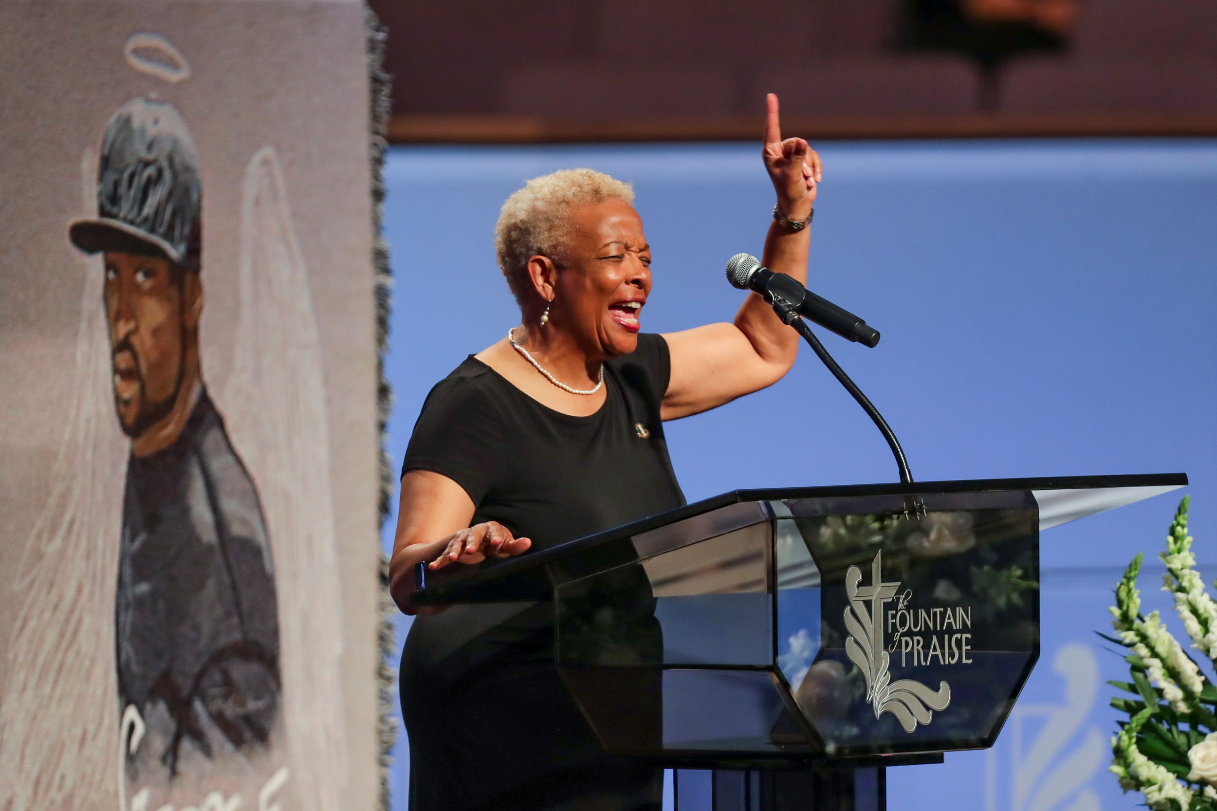 The Rev. Dr. Mary White prays during the private funeral for George Floyd at The Fountain of Praise church on June 9 in Houston. 