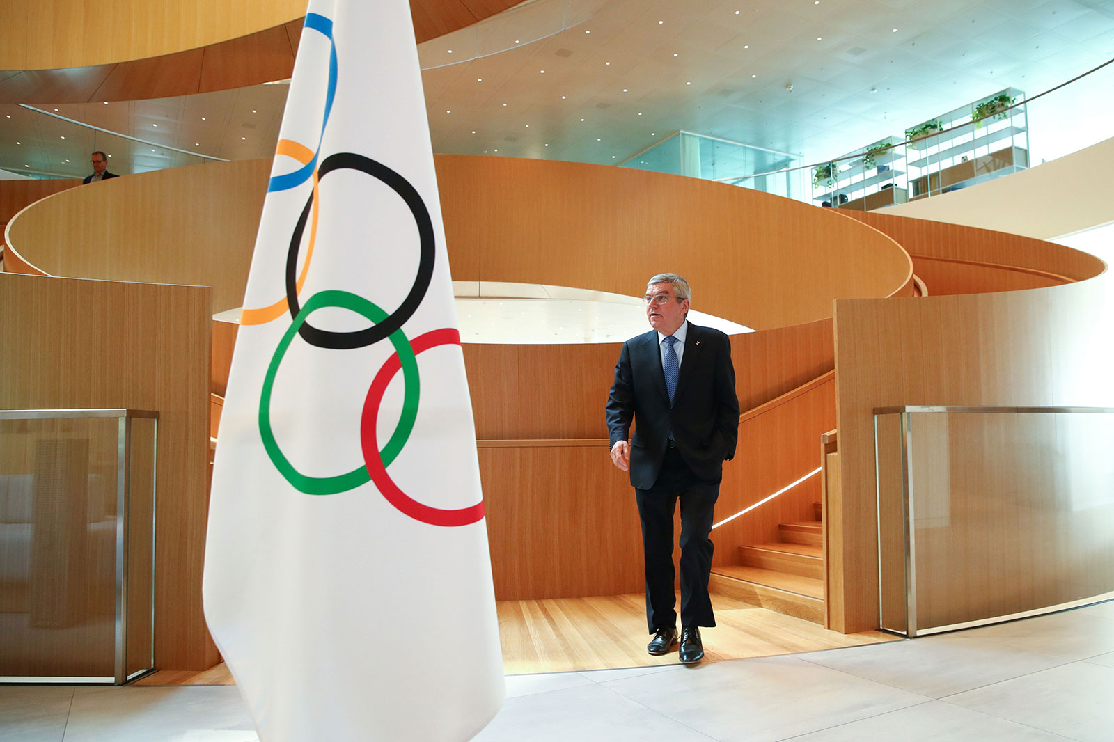 In this March 25 photo, IOC President Thomas Bach arrives for an interview after the historic decision to postpone the 2020 Tokyo Olympic Games due to the coronavirus pandemic, in Lausanne, Switzerland.