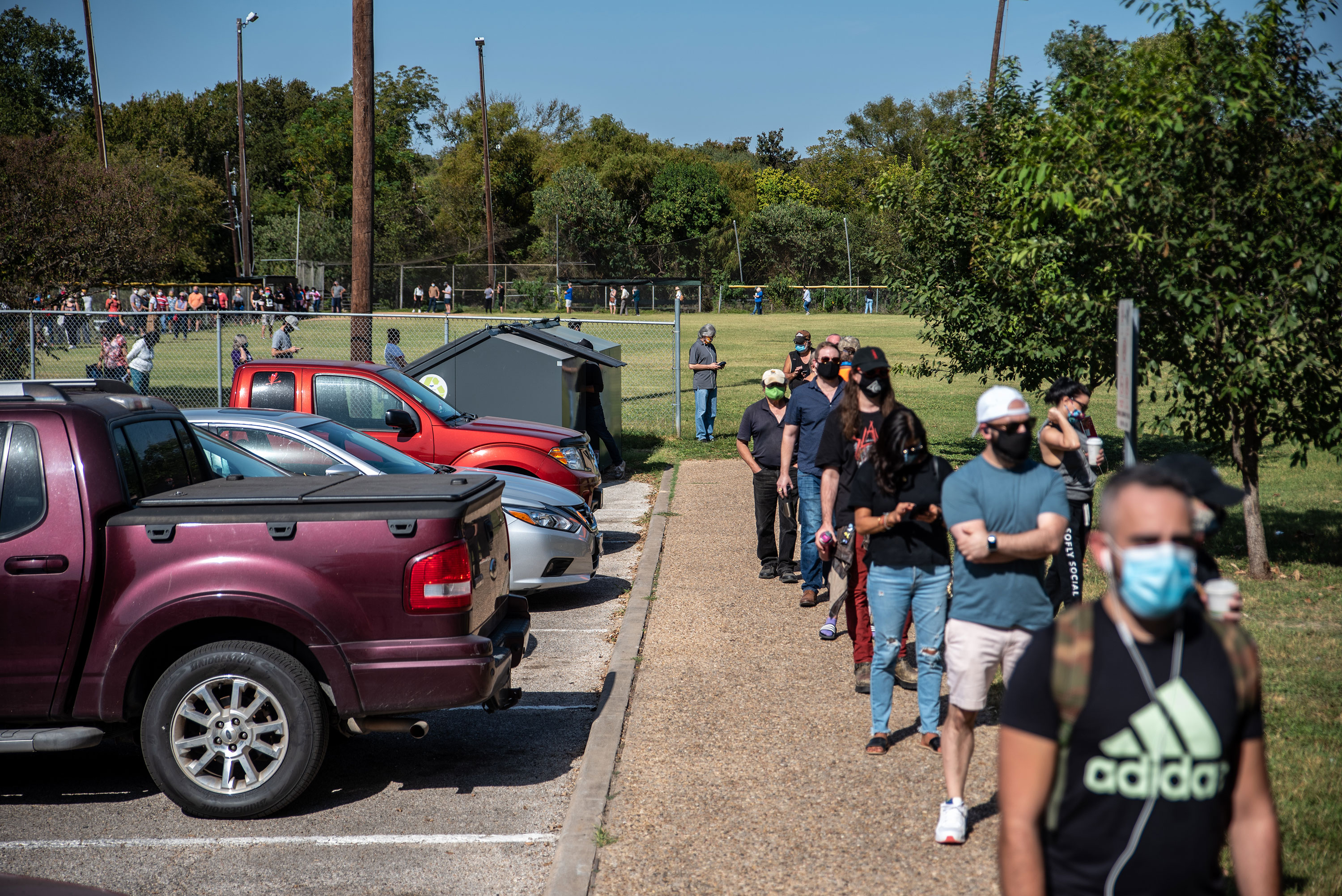 Voters wait in line to vote in Austin, Texas, on October 13.