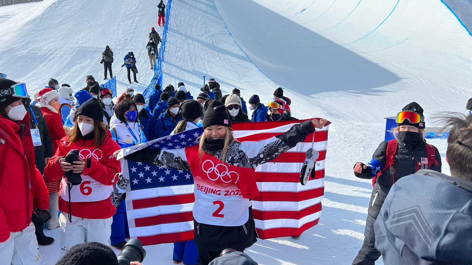 Chloe Kim celebrates with the US flag after winning gold medal in the women's snowboarding halfpipe final Thursday.
