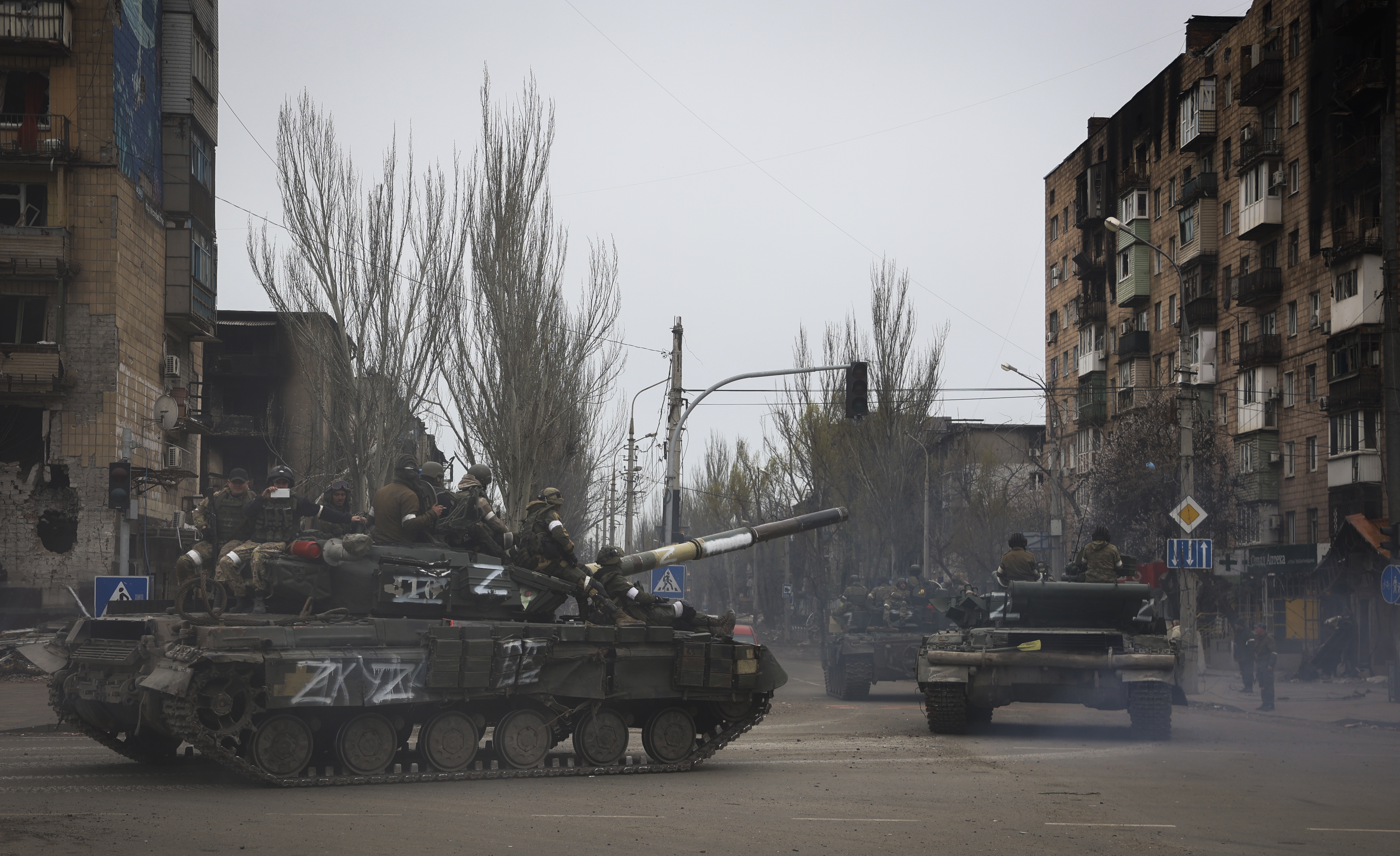 Russian military vehicles move in an area controlled by Russian-backed separatist forces in Mariupol, on Saturday, April 23.