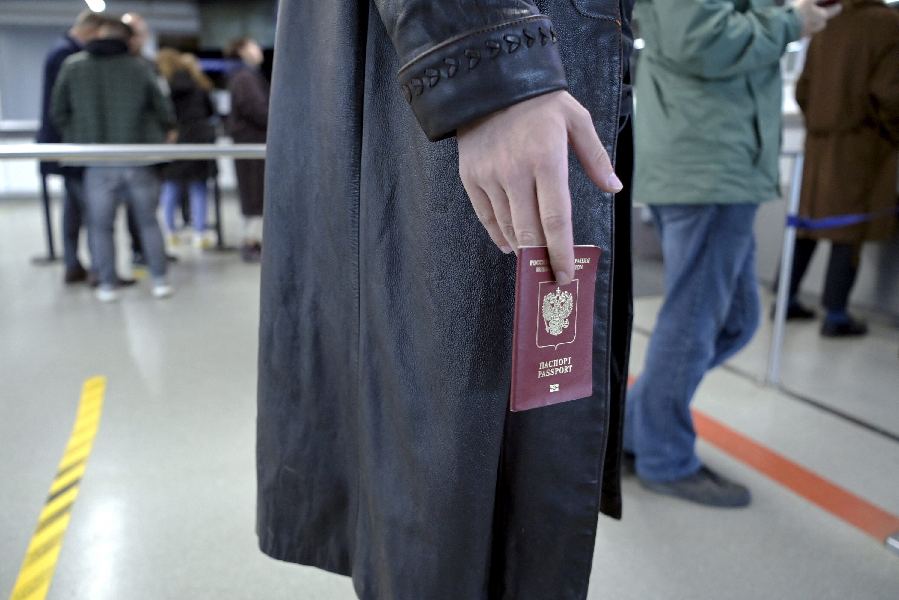 A Russian citizen waits in a line to have his passport checked at the Vaalimaa border checkpoint in Virolahti, Finland on September 25.