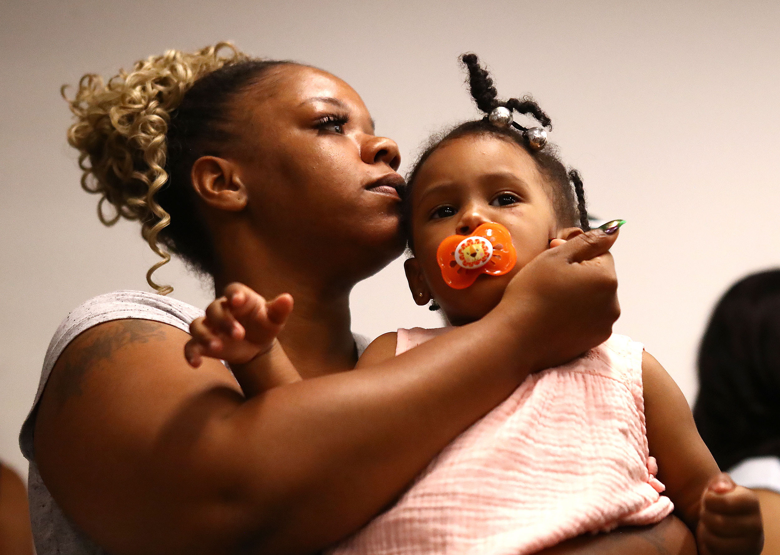 Tomika Miller, the widow of Rayshard Brooks, holds their daughter Memory during a press conference in Atlanta on Monday, June 15.