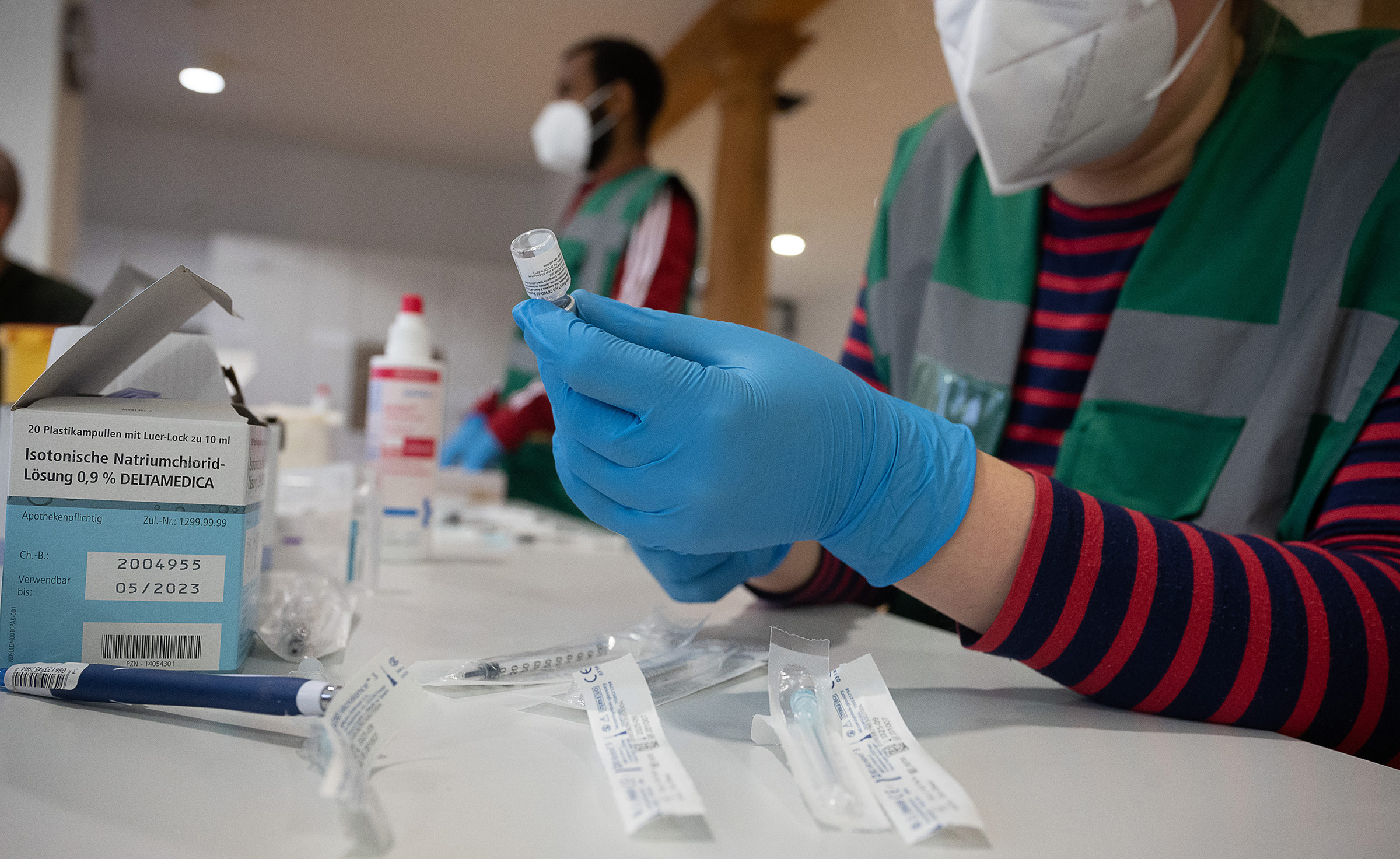 A member of a mobile vaccination team prepares doses of the Biontech/Pfizer vaccine in Tübingen, Germany on February 5. 