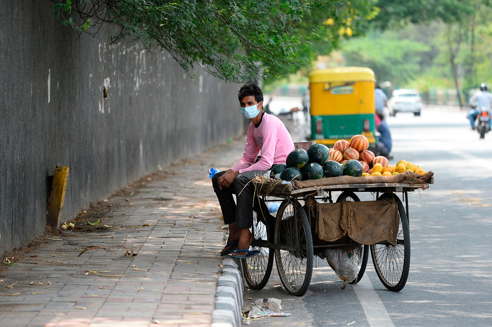 A fruit vendor waits for customers in New Delhi on May 31.