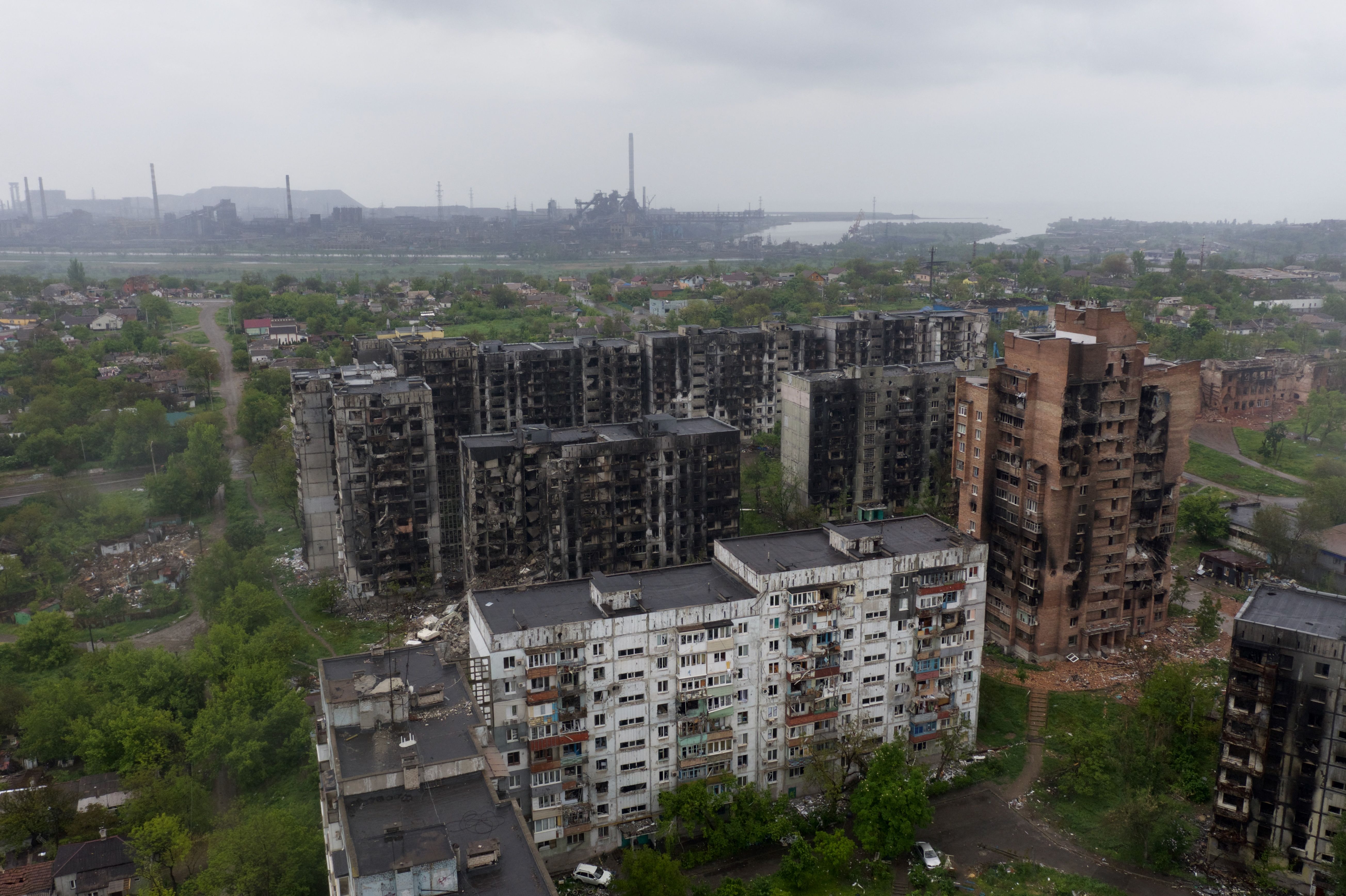An aerial view of damaged residential buildings and the Azovstal steel plant in the background in the port city of Mariupol, on Wednesday, May 18.